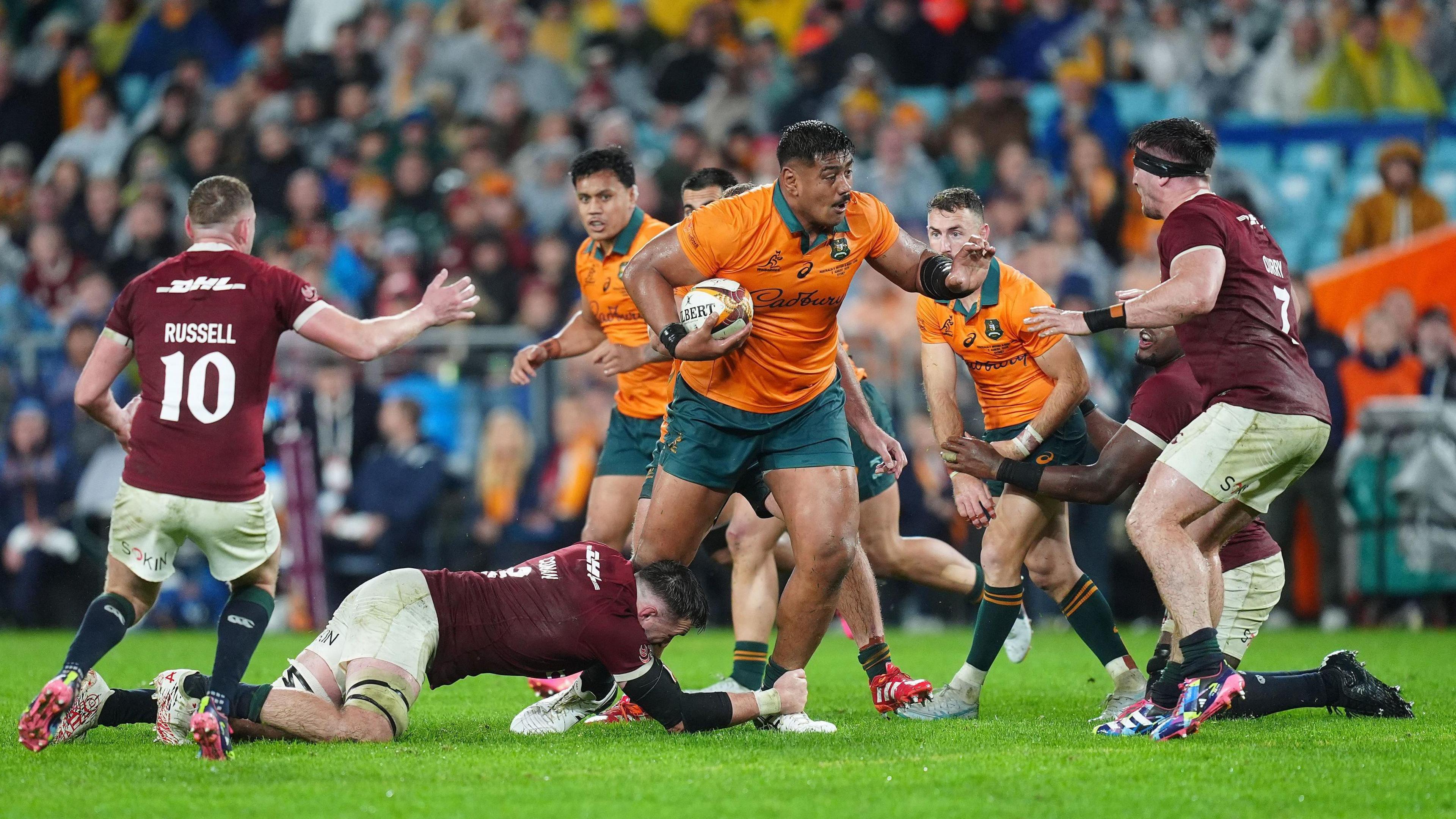 Australia's Will Skelton powers his way through the Lions defensive line