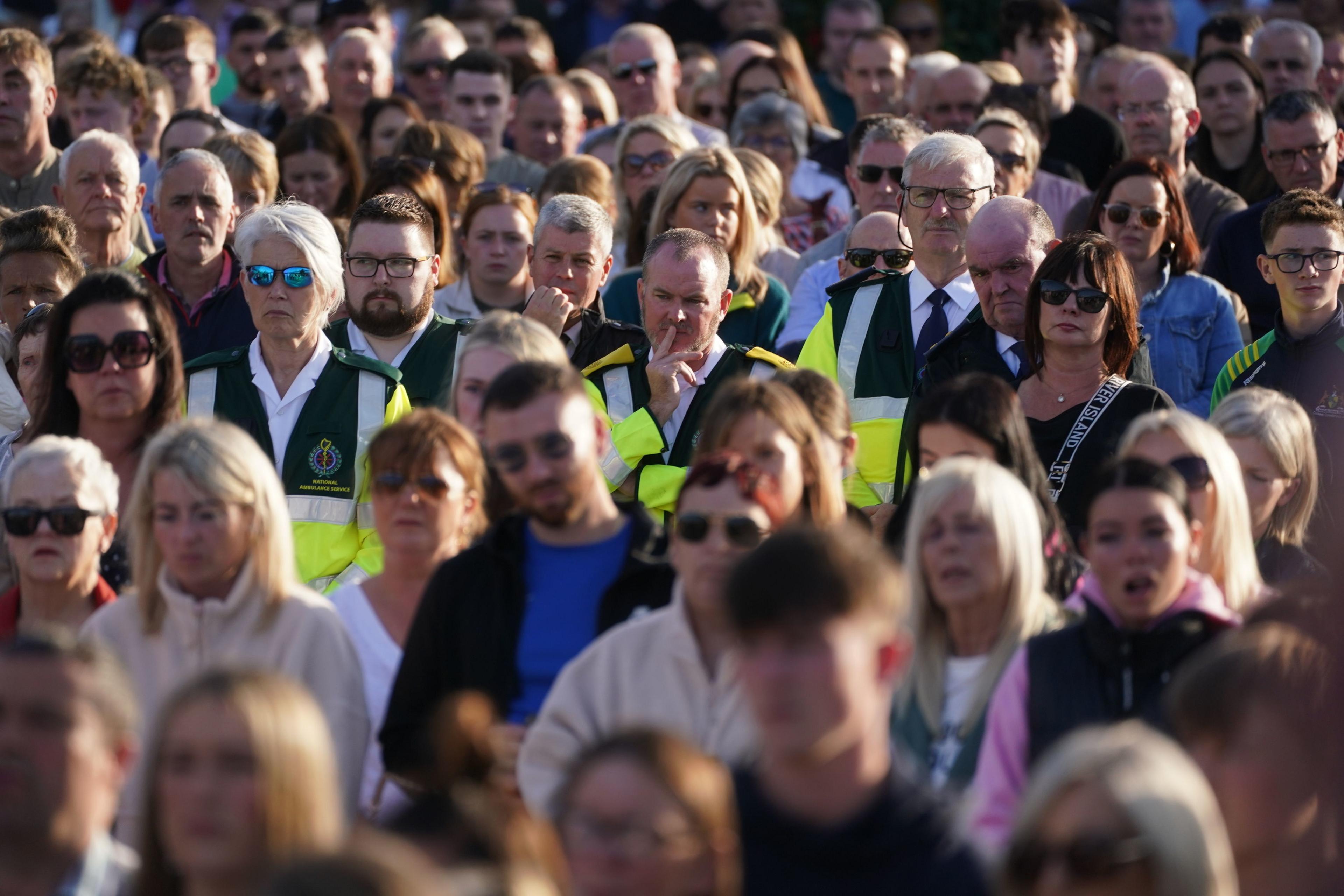 Members of the National Ambulance Service clonmel vigil crowd