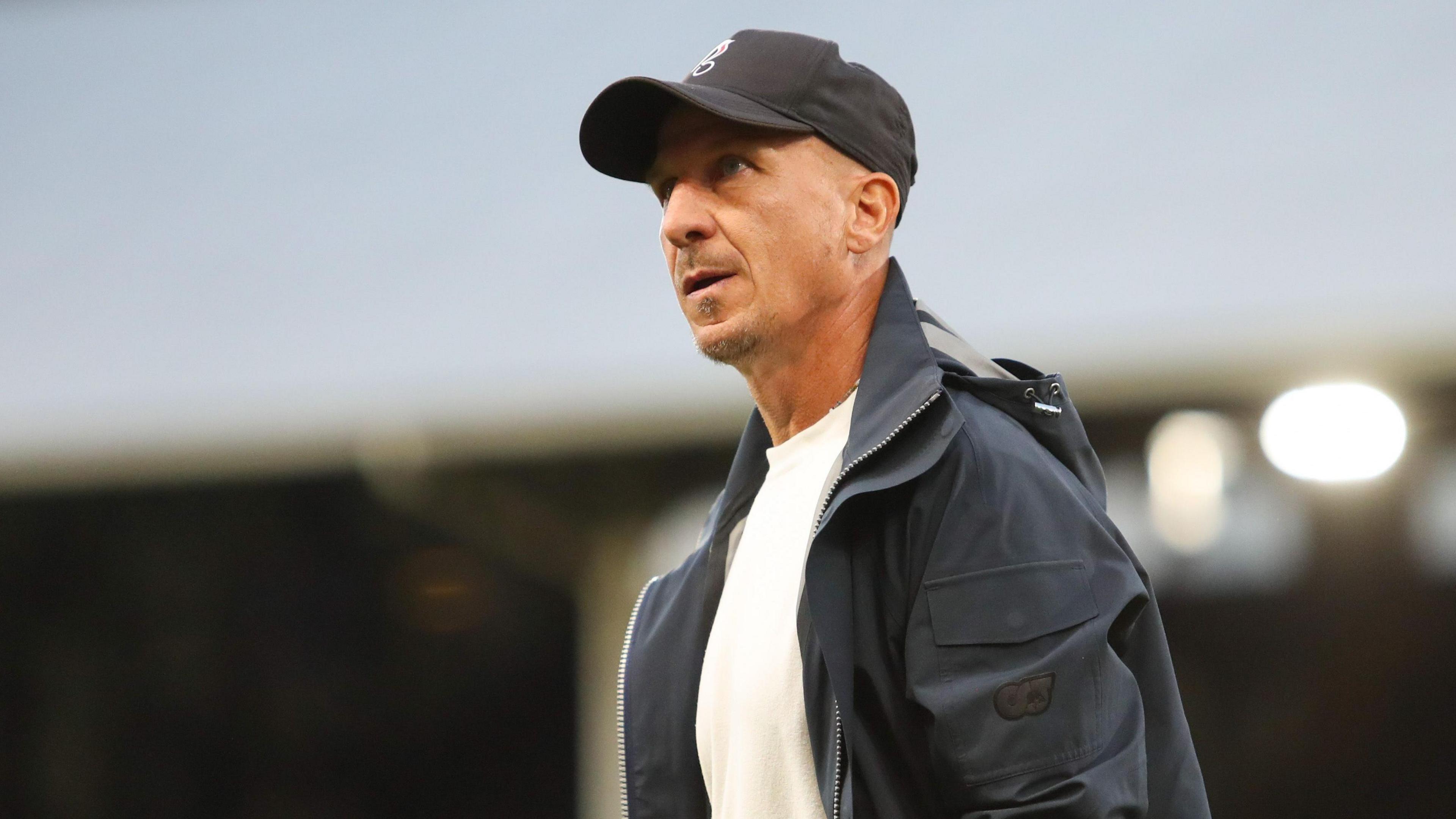 Gerhard Struber walks with his hand in his pocket at the end of a match