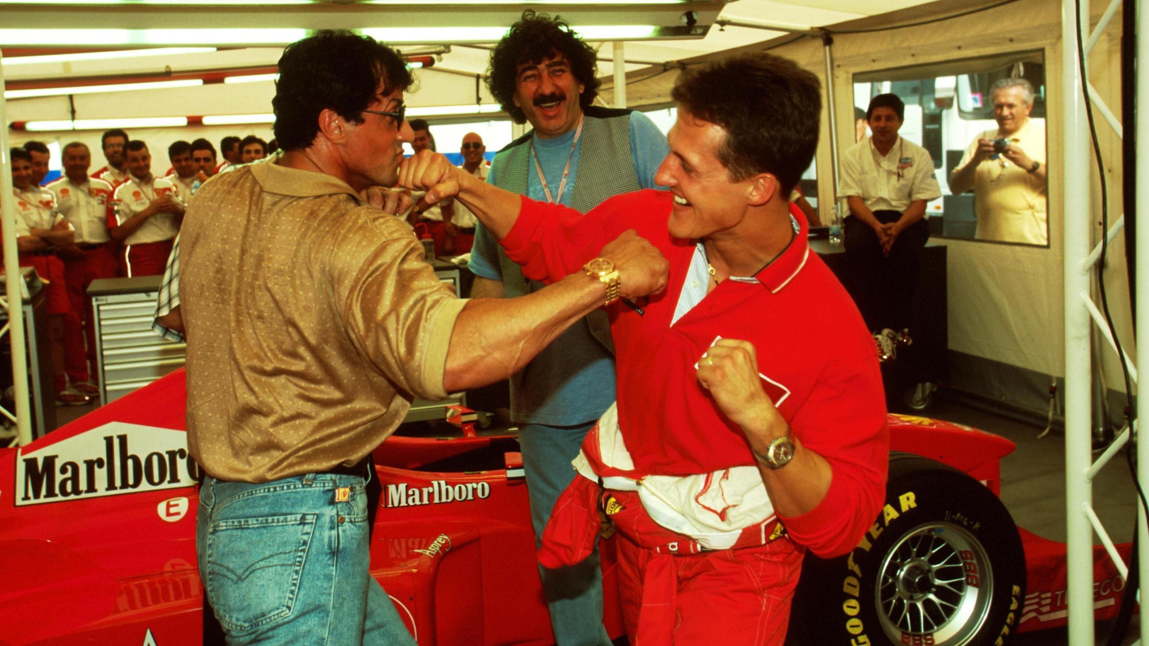 Actor Sylvester Stallone and Ferrari's Michael Schumacher pretend to box in 1998