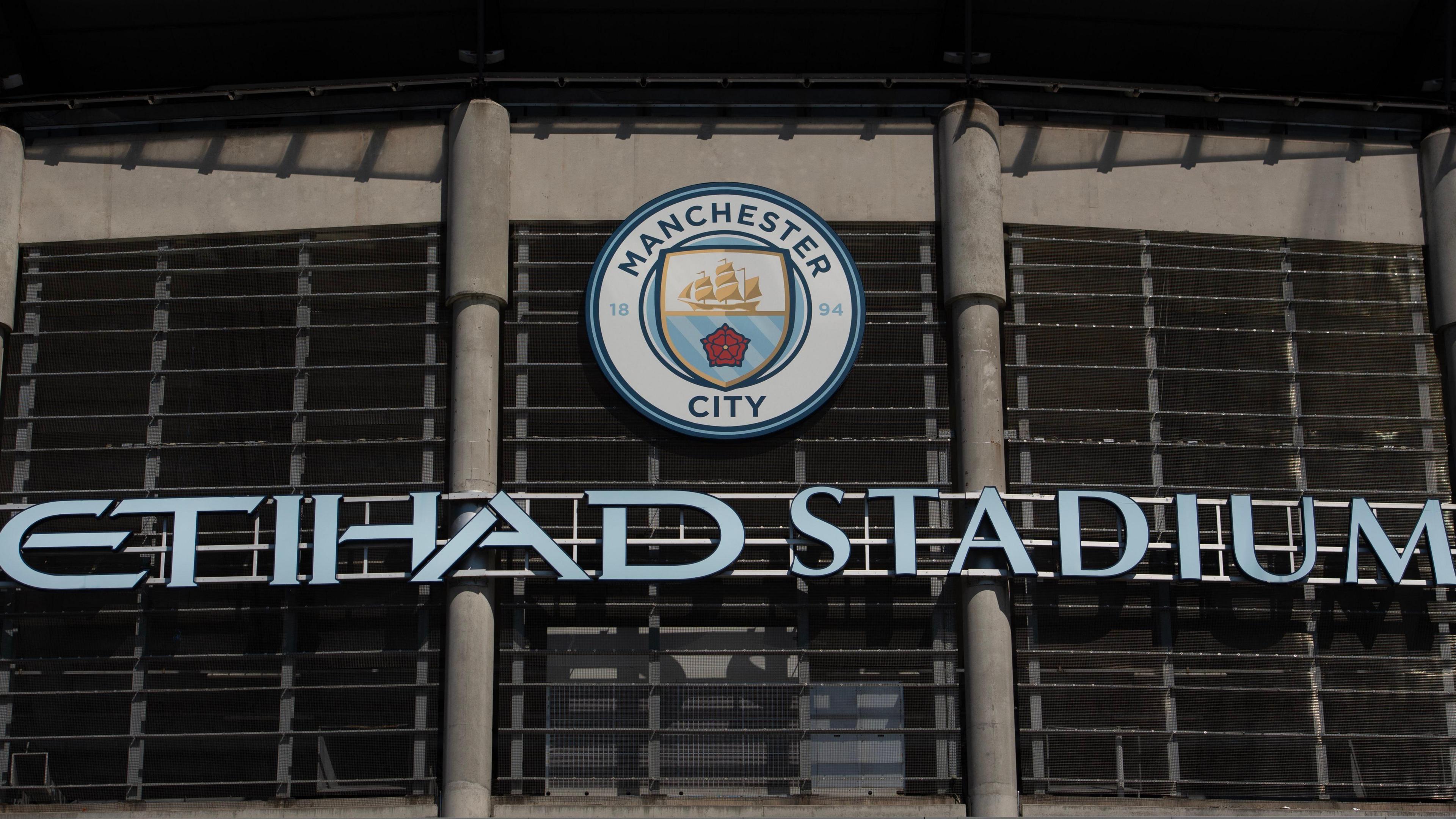 A general view of the Etihad Stadium sign and badge at Manchester City's home ground