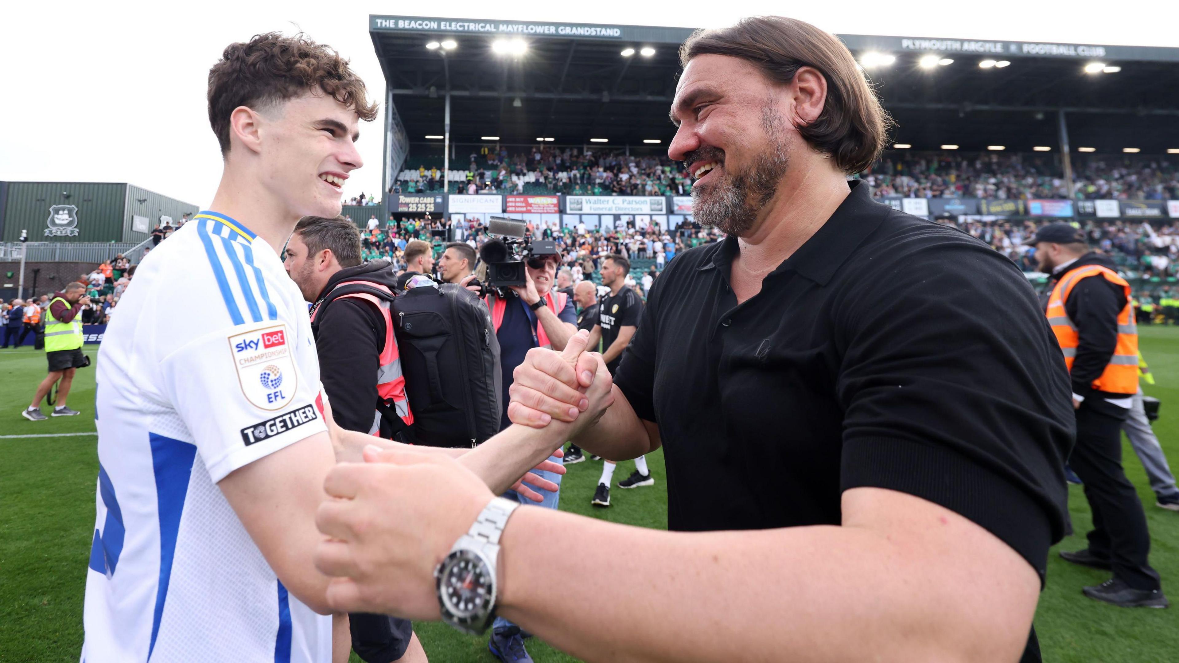 Leeds boss Daniel Farke celebrates promotion with Sam Byram