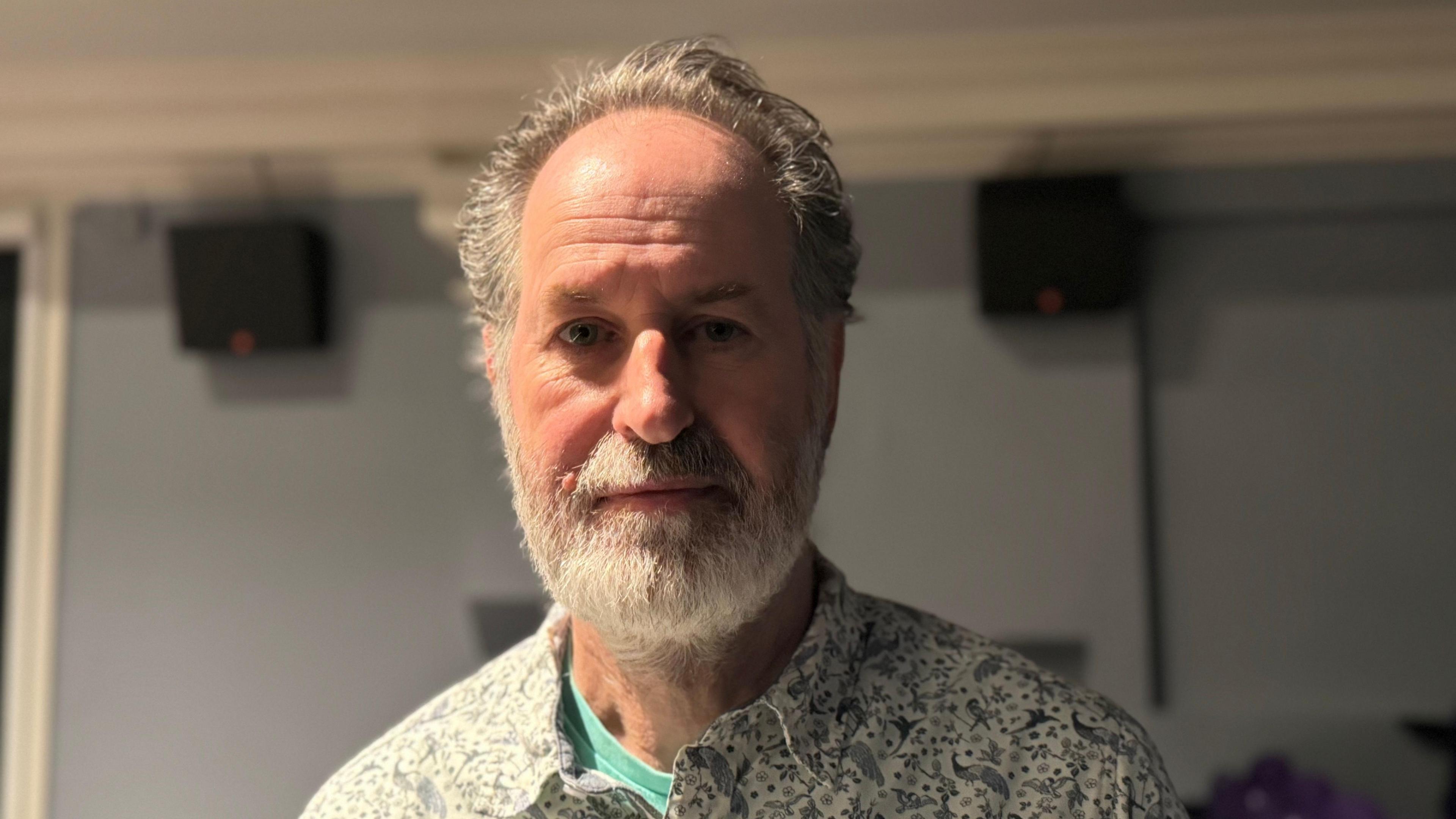 Keith Garrow, General Manager of Dorking Halls, looks straight at the camera.