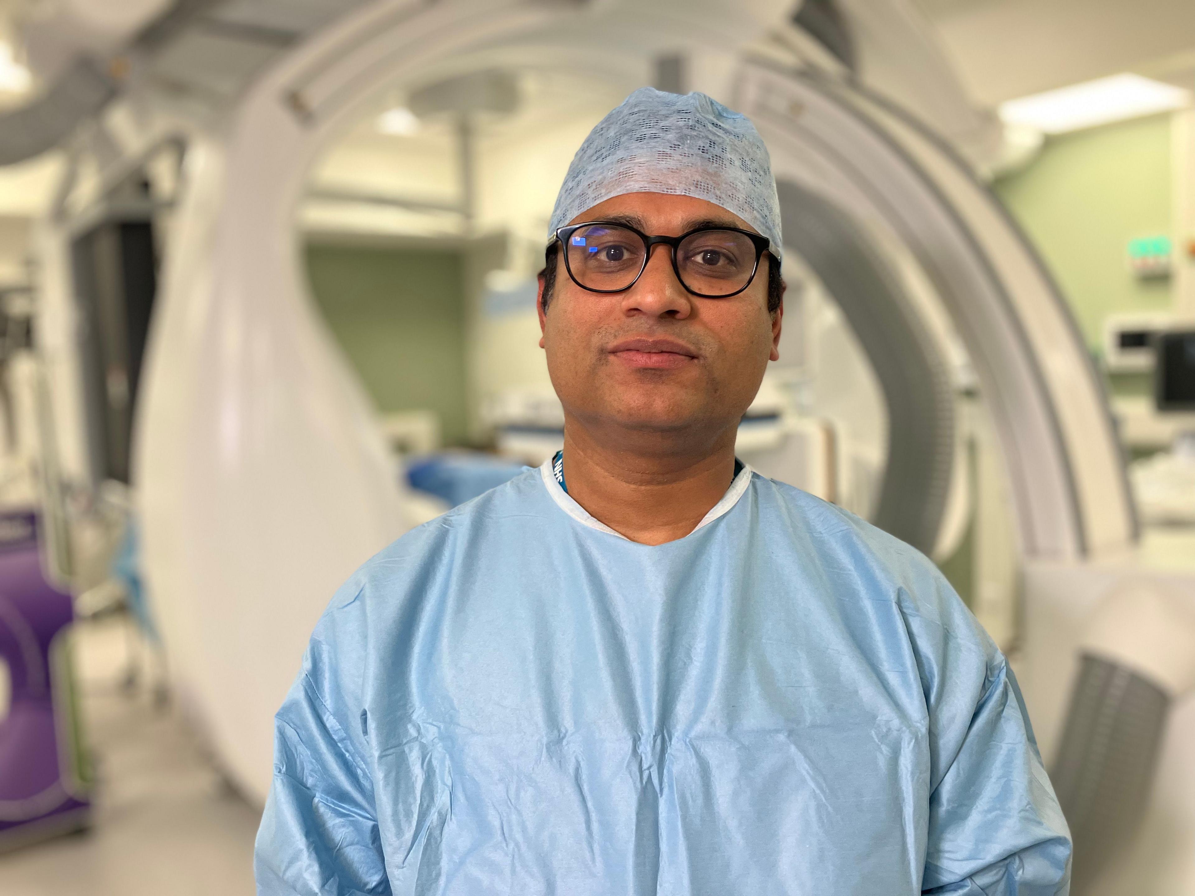 Dr Sujit Nair looks into the camera in one of the QMC's IR theatres