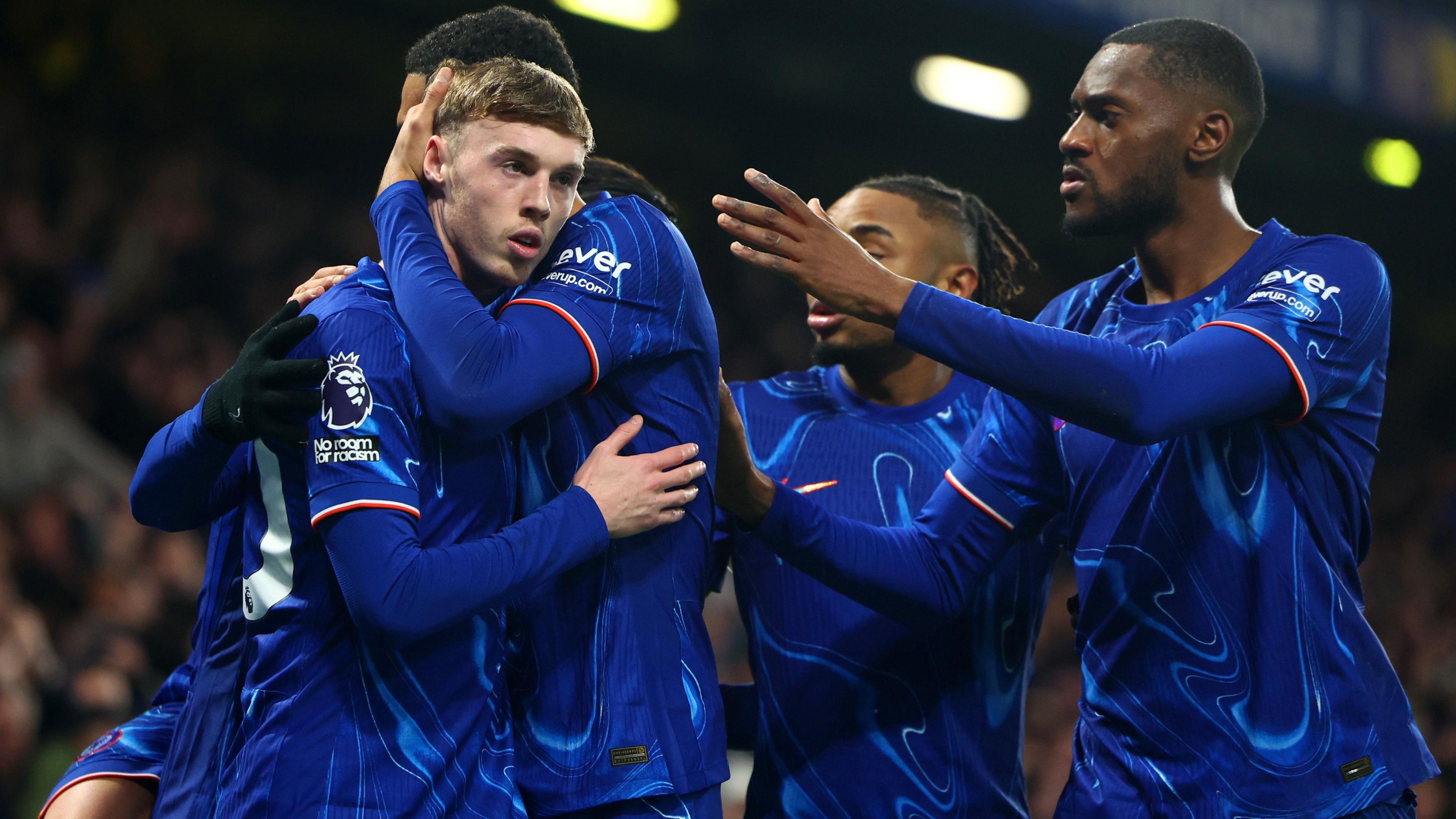 Cole Palmer is congratulated by his team-mates after Chelsea's second goal against West Ham