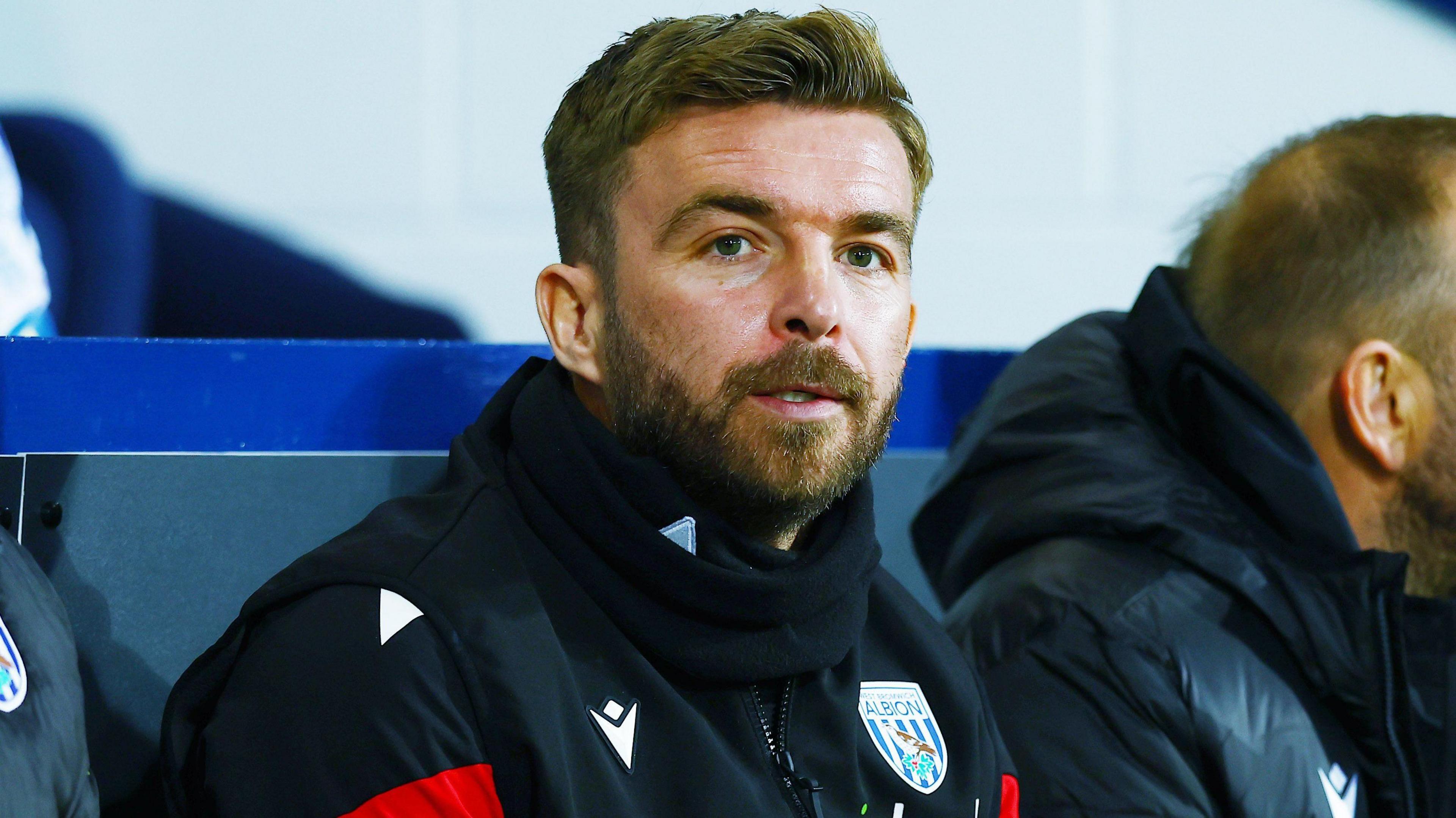 West Bromwich Albion head coach James Morrison watches on from the dug out during a game