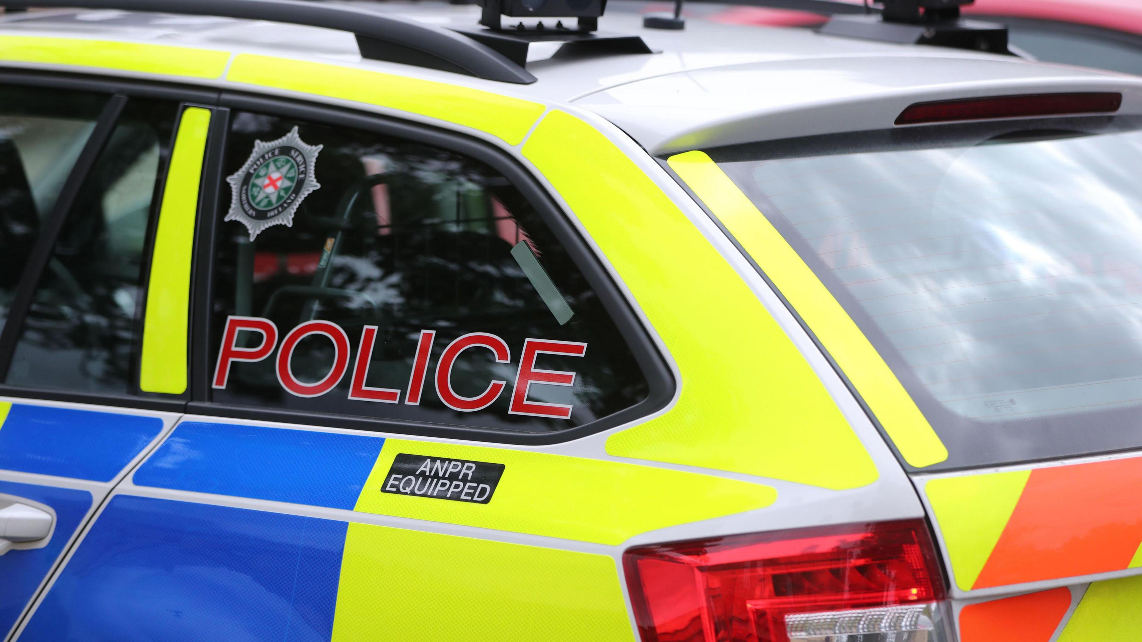 PSNI car yellow and bluw branding