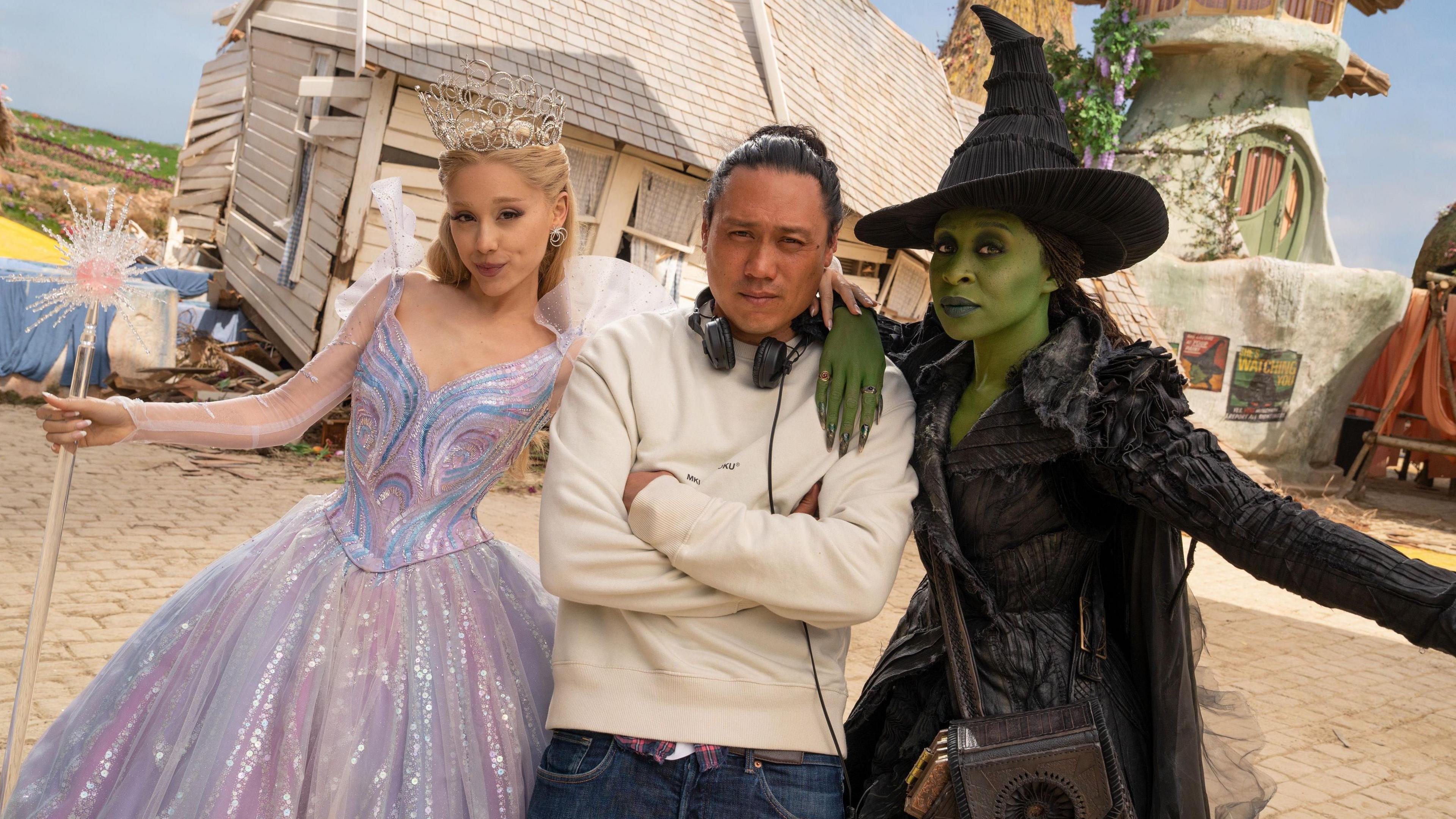 Director Jon M Chu on set with Ariana Grande and Cynthia Erivo