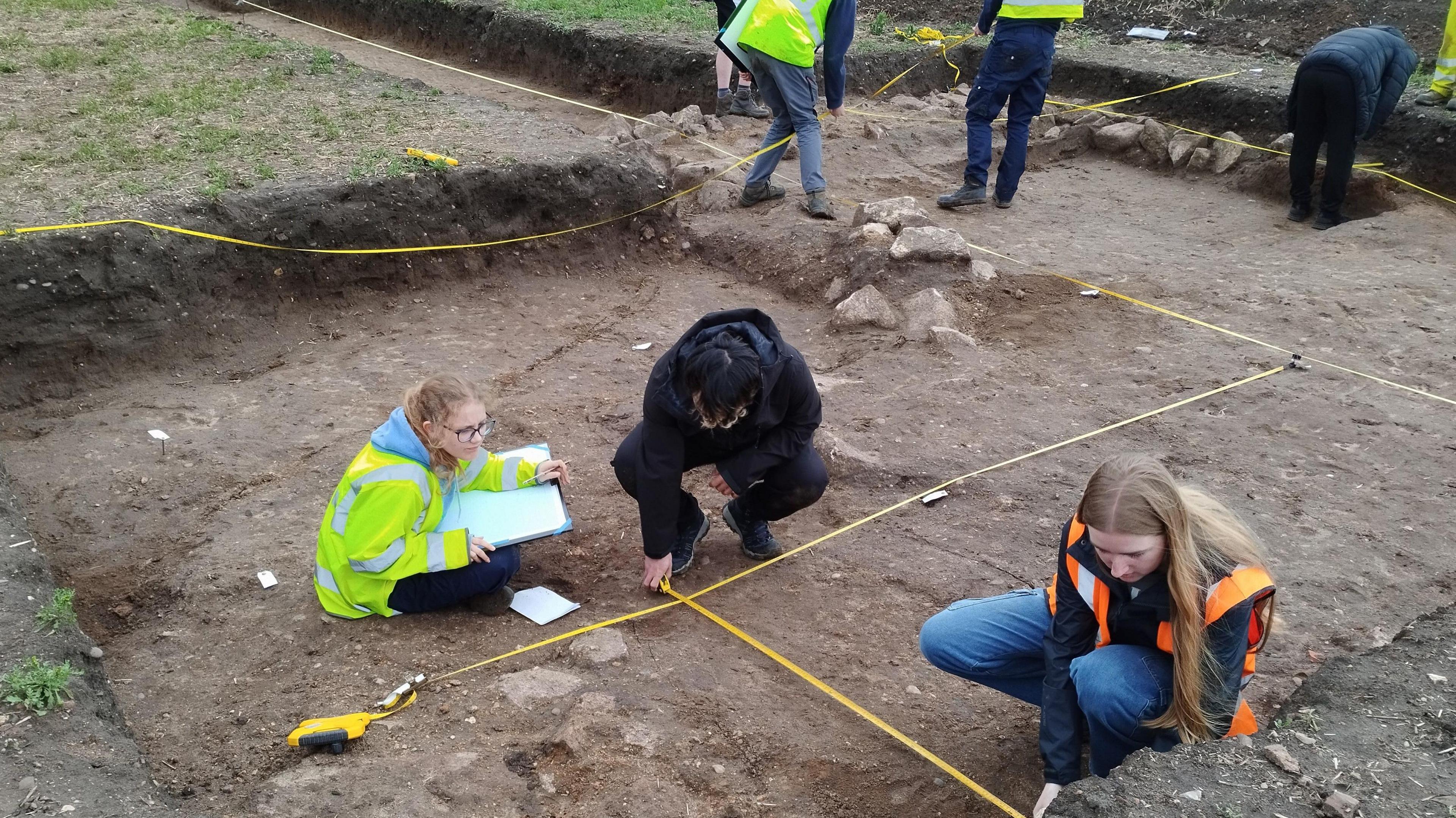 Students planning the foundations of the villa