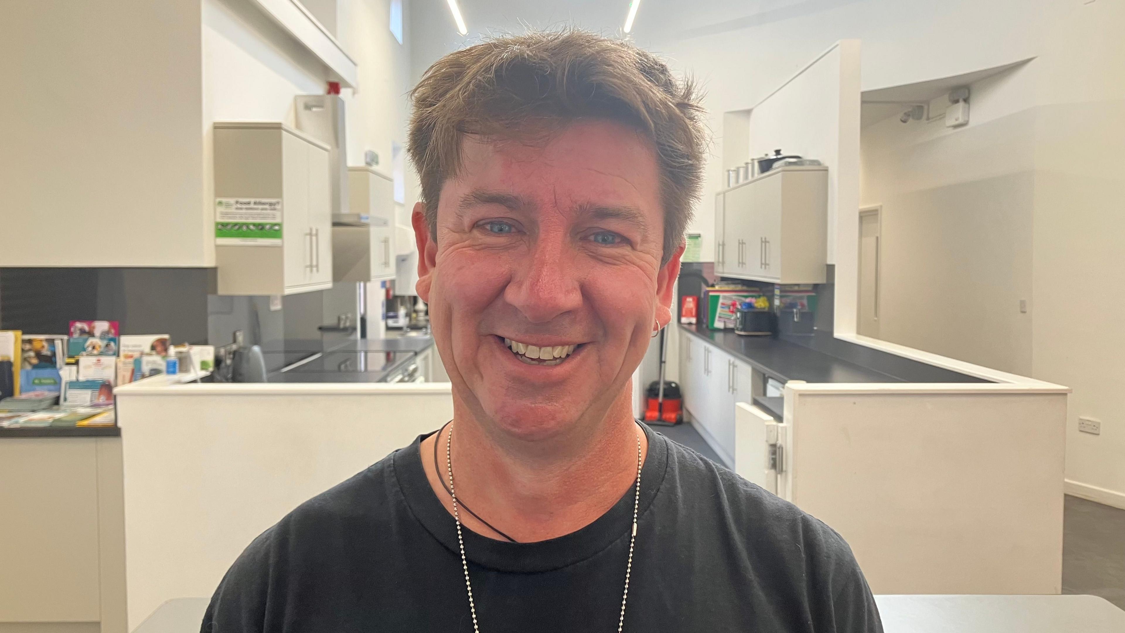 Craig Lloyd smiling at the camera standing in front of a kitchen at the Recreation Centre on the Hamp estate in Bridgwater