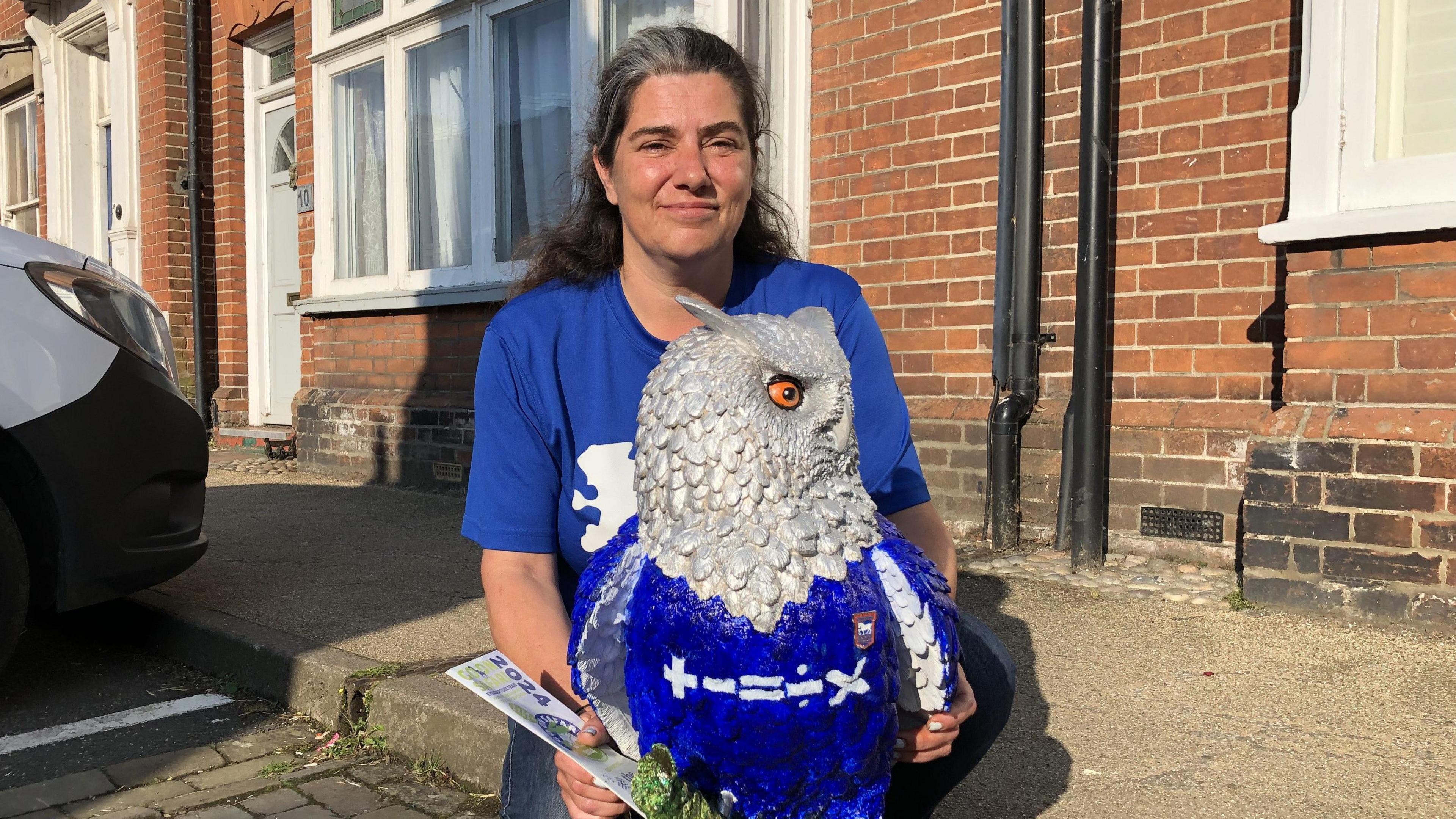 Clare Jackson with the owl statue before it was damaged