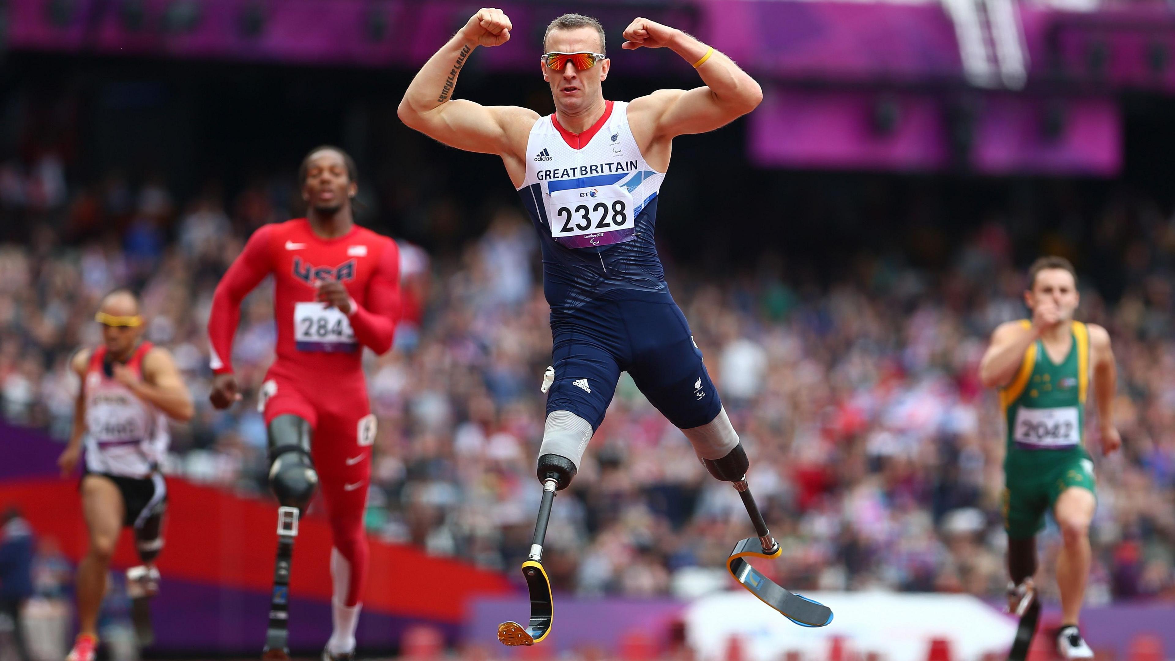 Richard Whitehead of Great Britain celebrates winning gold in the men's 200m - T42 