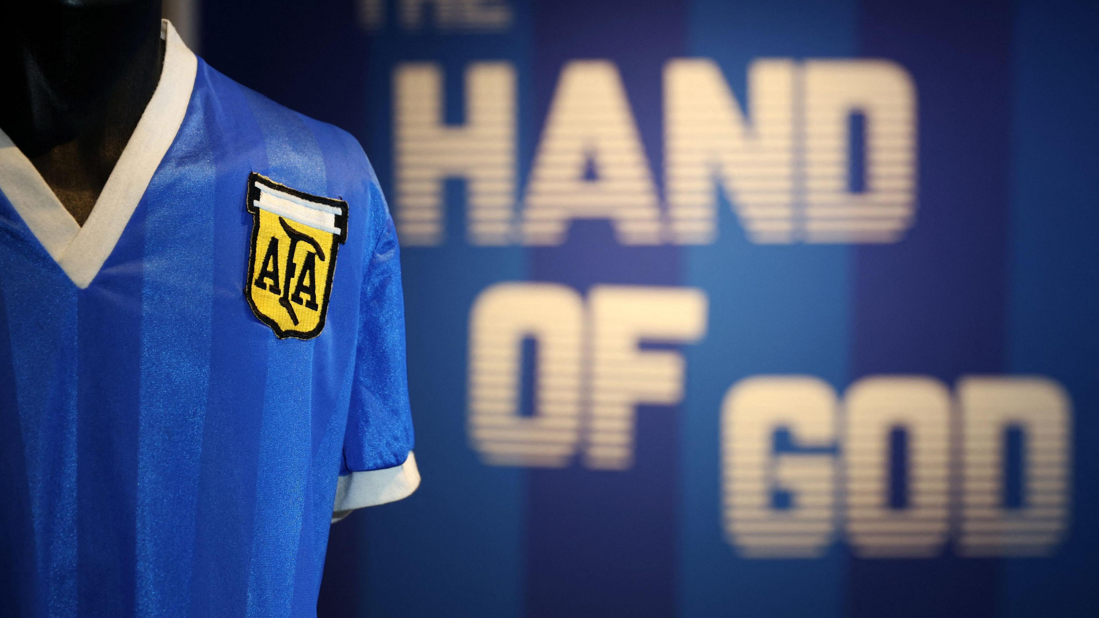 A football shirt worn by Argentina's Diego Maradona during the 1986 World Cup quarter-final match against England is pictured during a photocall at Sotheby's auction house in London