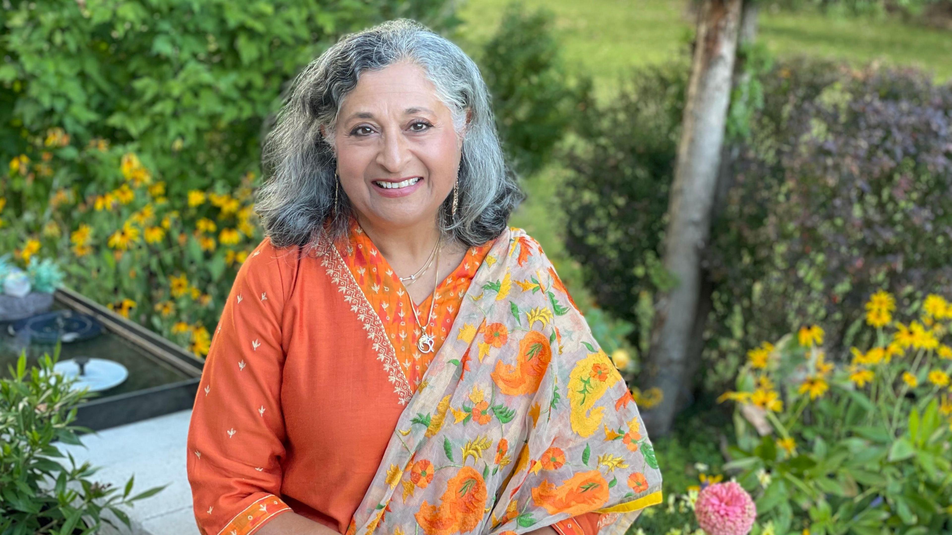 An Indian woman dressed in a sari