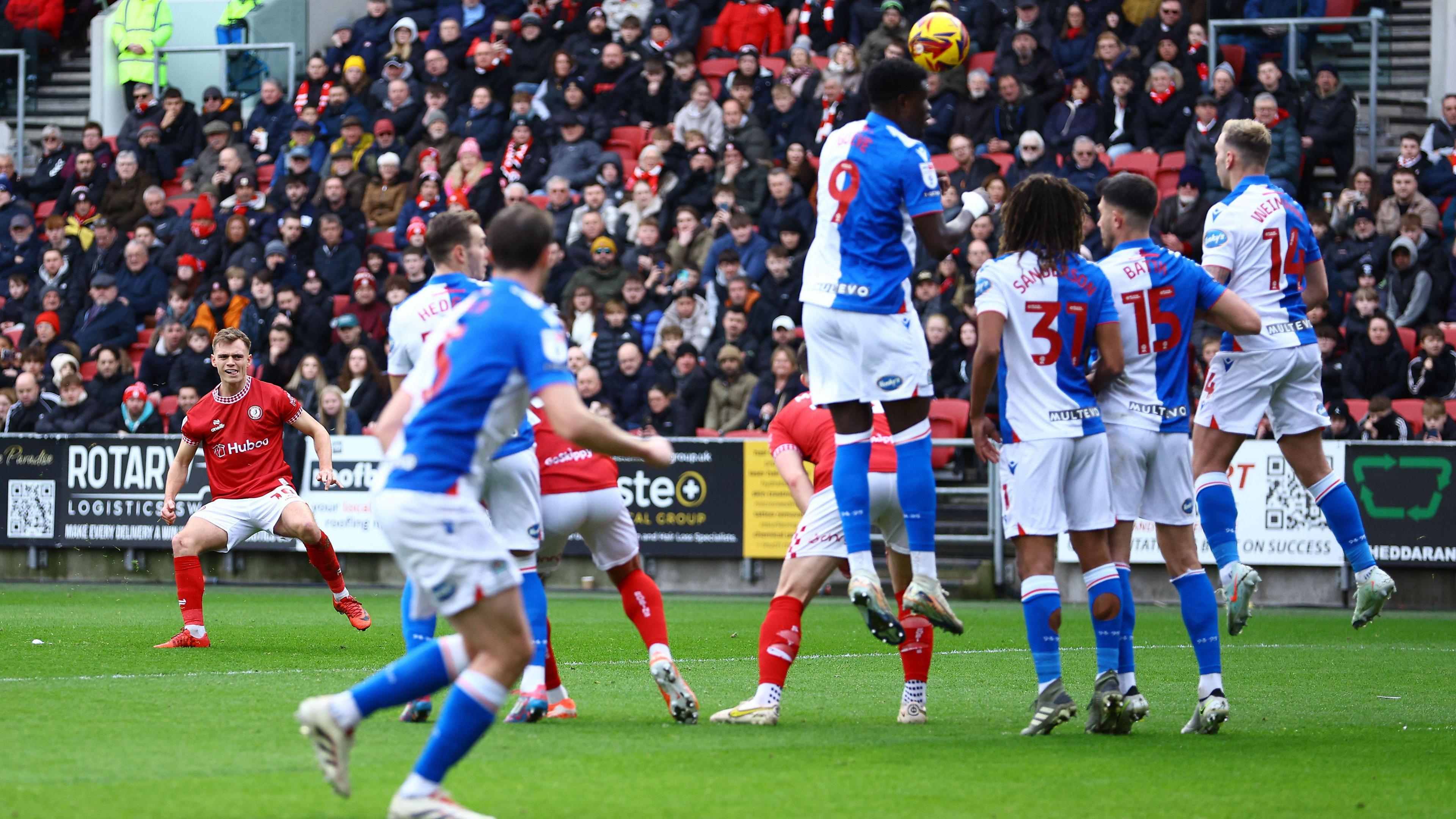 Scott Twine (left) bends his free-kick over the Blackburn wall and into the back of the net