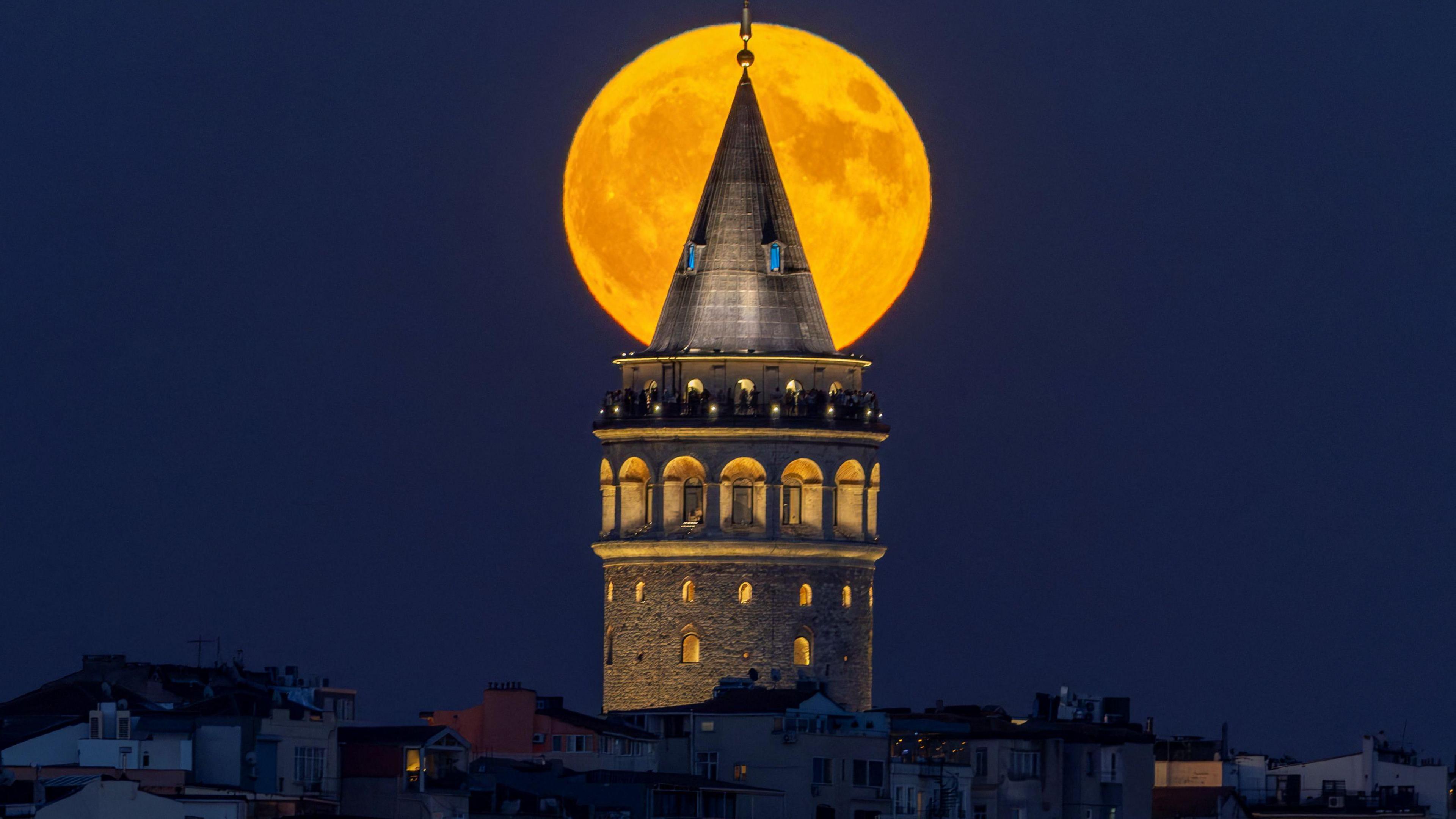 Supermoon hiding behind Galata Tower in Turkiye