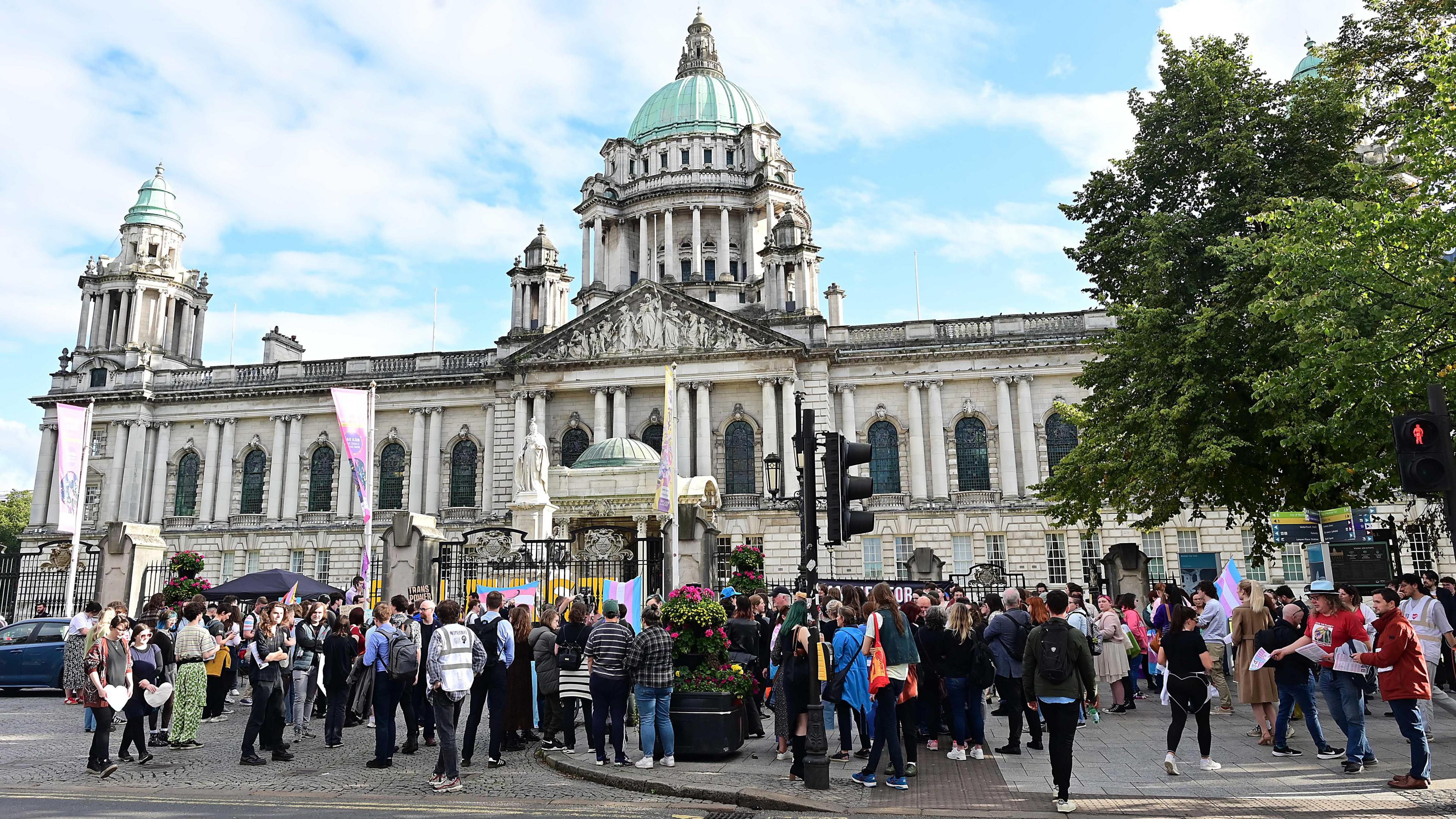 Dozen of young people taking part in a protest outside Belfast City Hall in August against a recent ban on puberty blockers