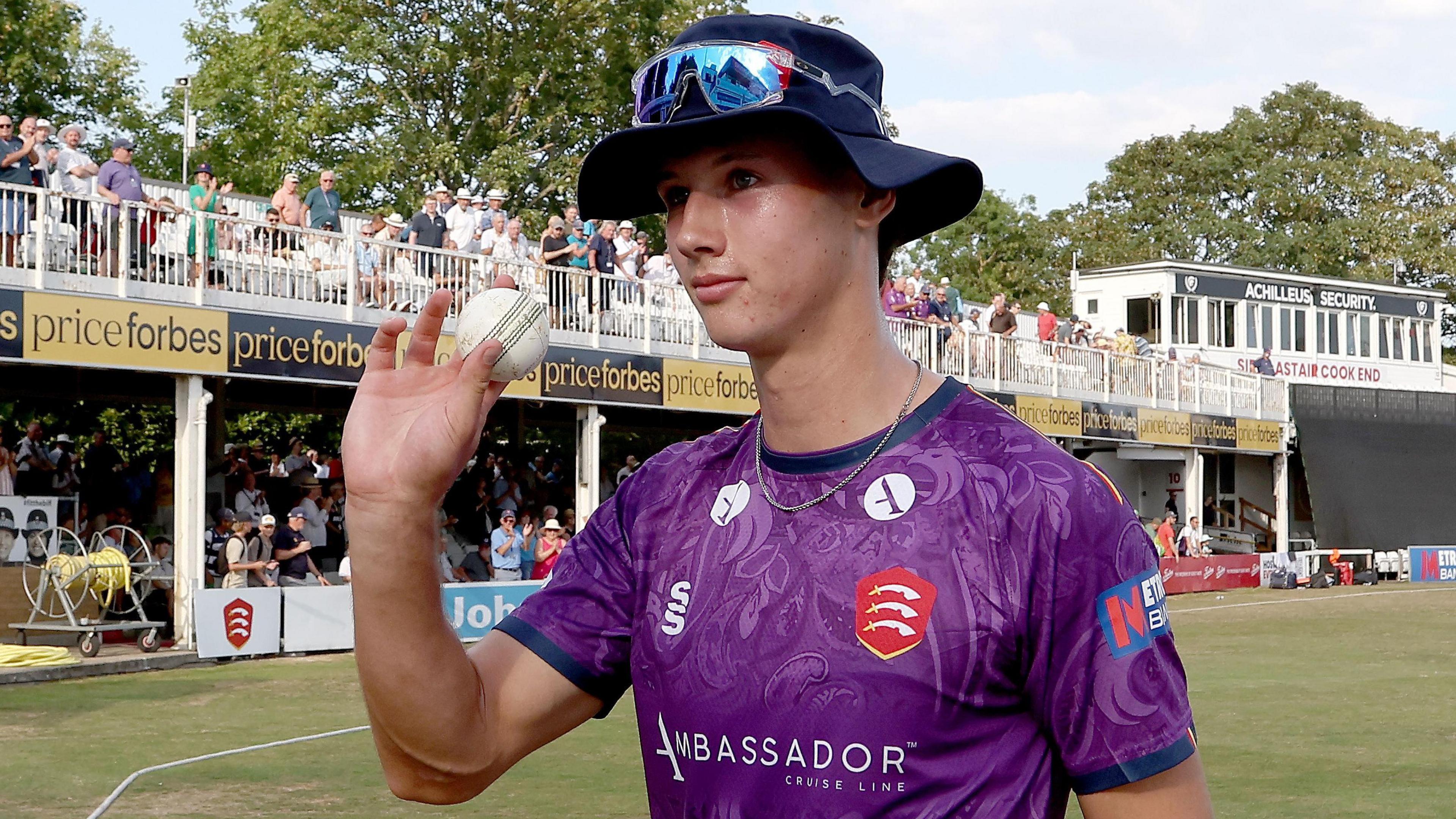 Charlie Bennett acknowledges his five-wicket haul against Surrey
