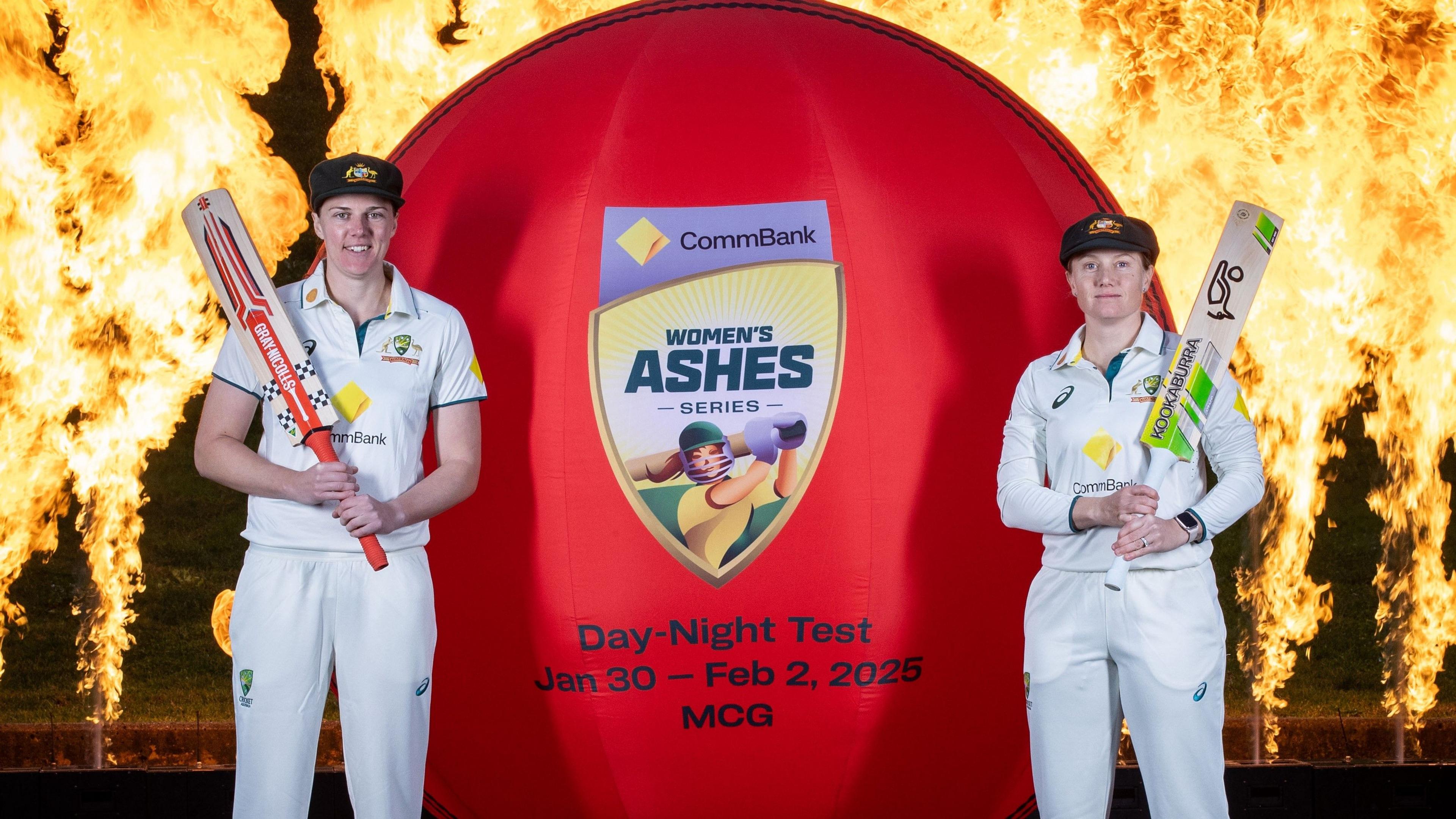 Australia players pose in front of flames to promote the Women's Ashes