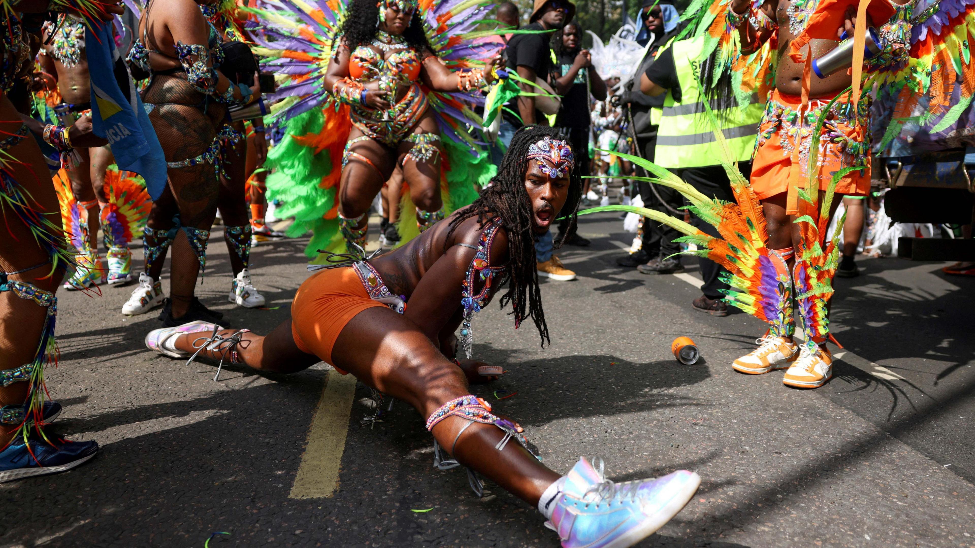 man doing the splits during the parade