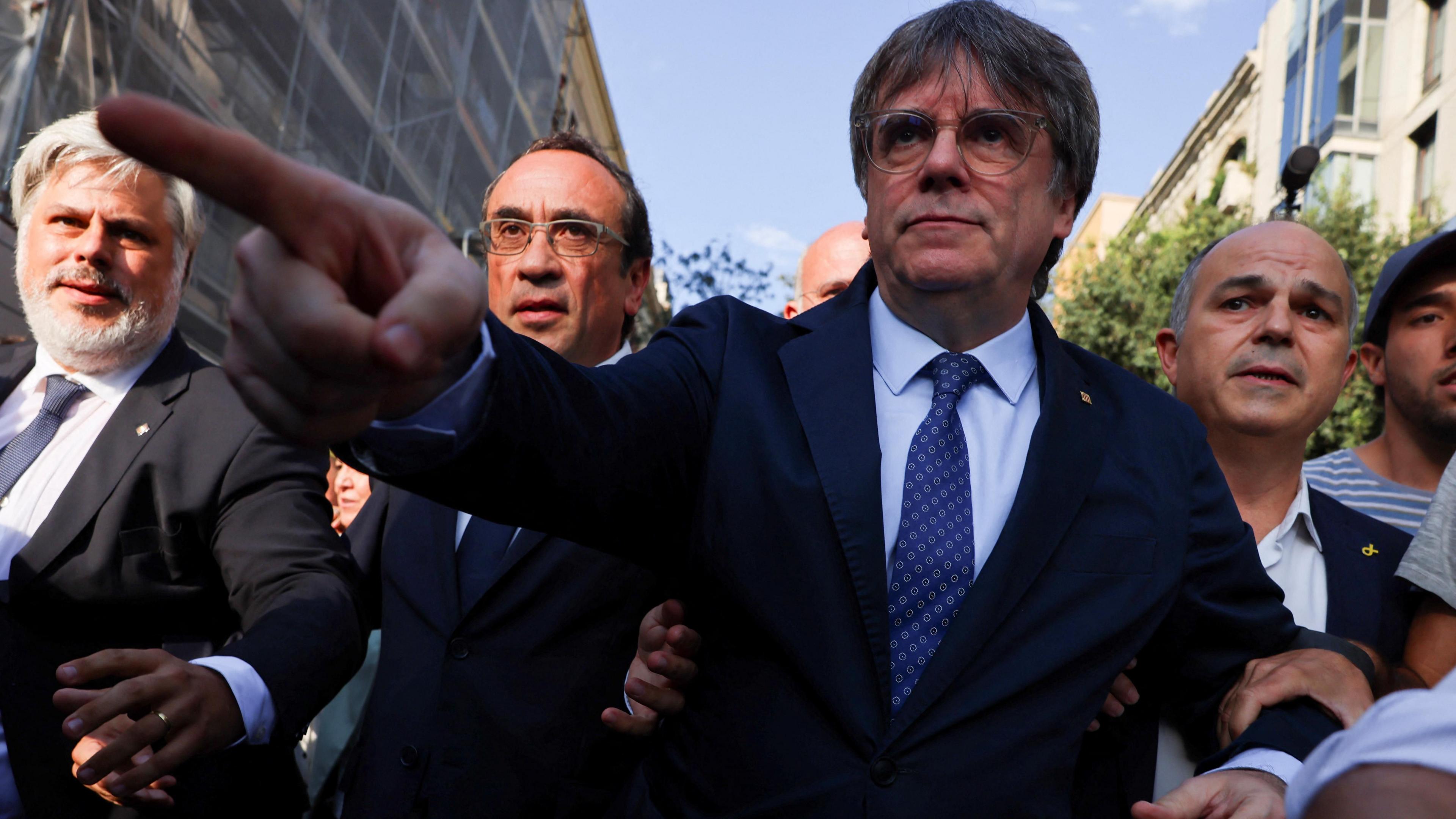 Catalan separatist leader Carles Puigdemont makes his way as he returns to Spain from seven years of self-imposed exile despite