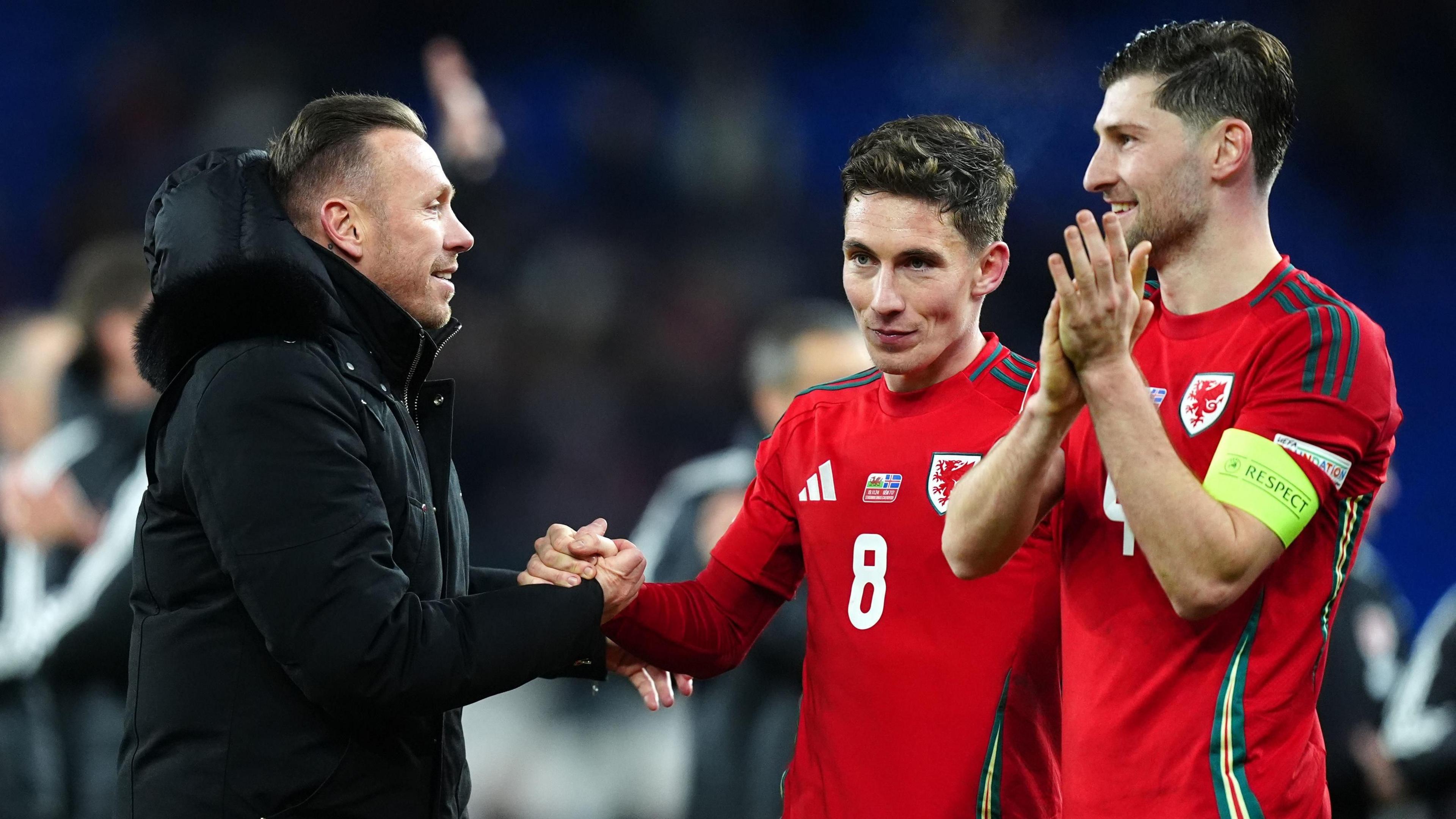 Wales manager Craig Bellamy celebrates with Harry Wilson and Ben Davies