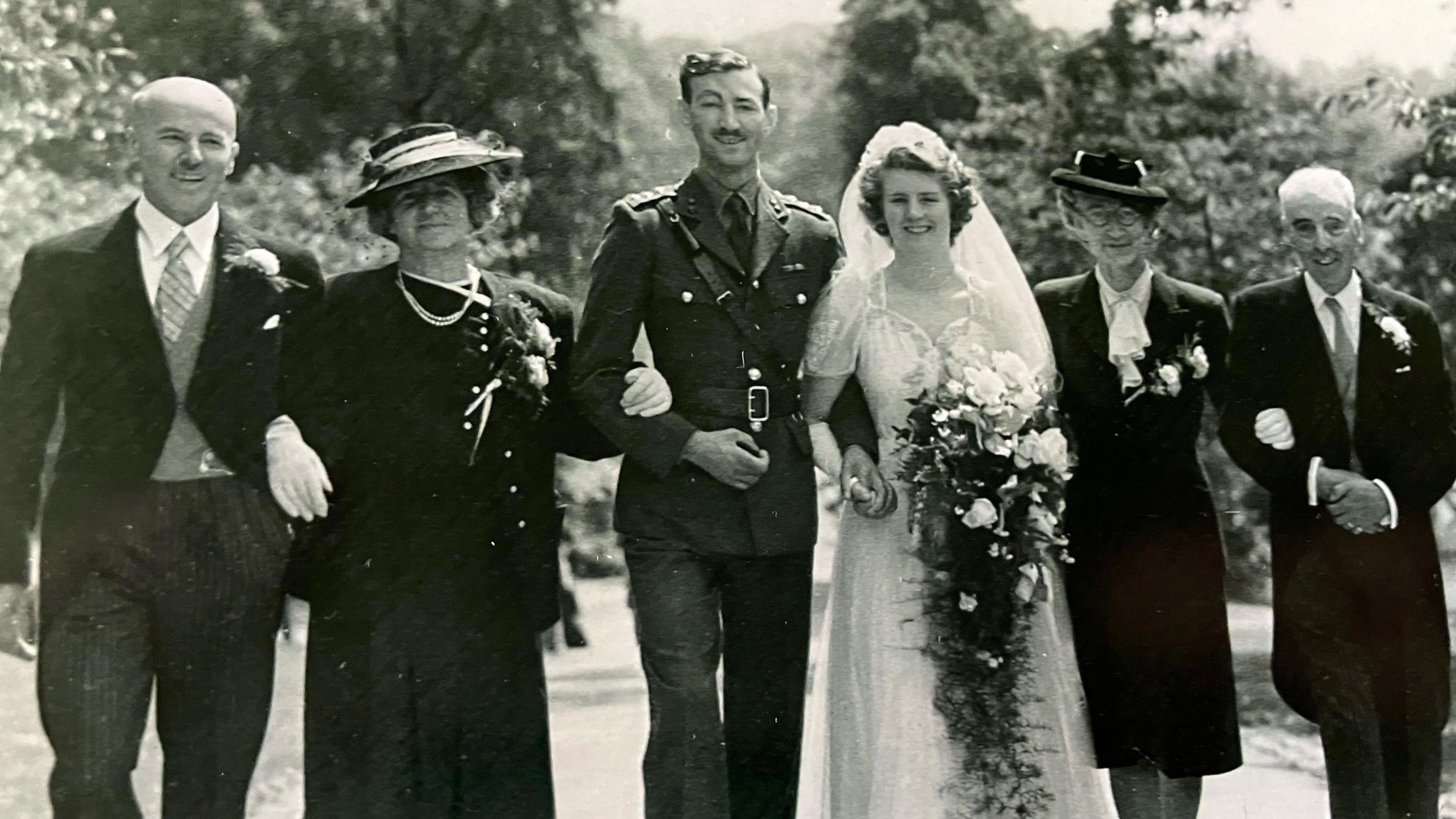 A photograph of a traditional 1940s English wedding 