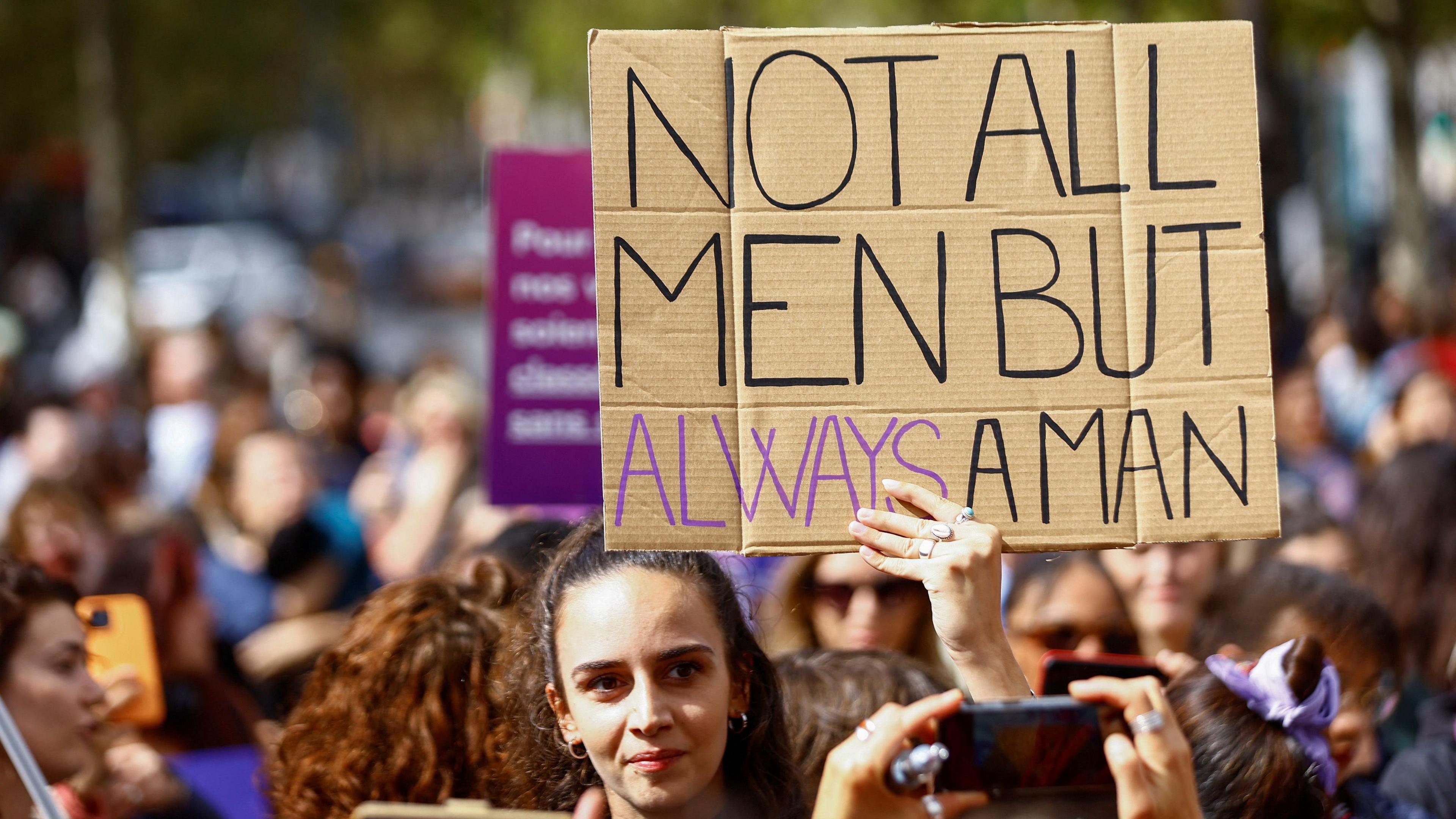 Demonstrators hold signs at a protest in support of rape victims and Gisele Pelicot, who was allegedly drugged and raped by men solicited by her husband Dominique Pelicot, as the trial continues, at the Place de la Republique in Paris, France, September 14, 2024