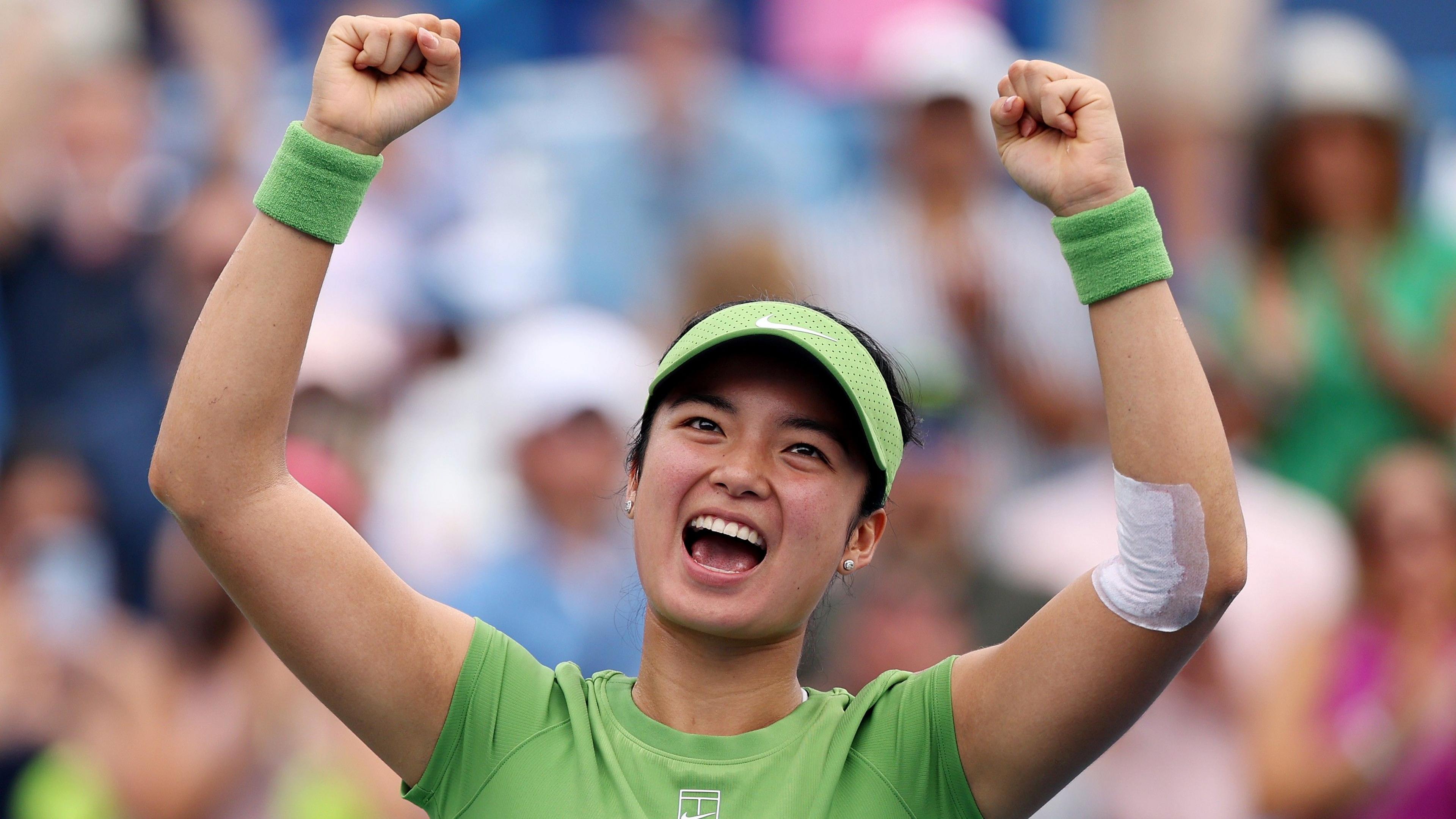 Alexandra Eala raises her arms in celebration after beating Naomi Osaka in the Washington Open semi-finals