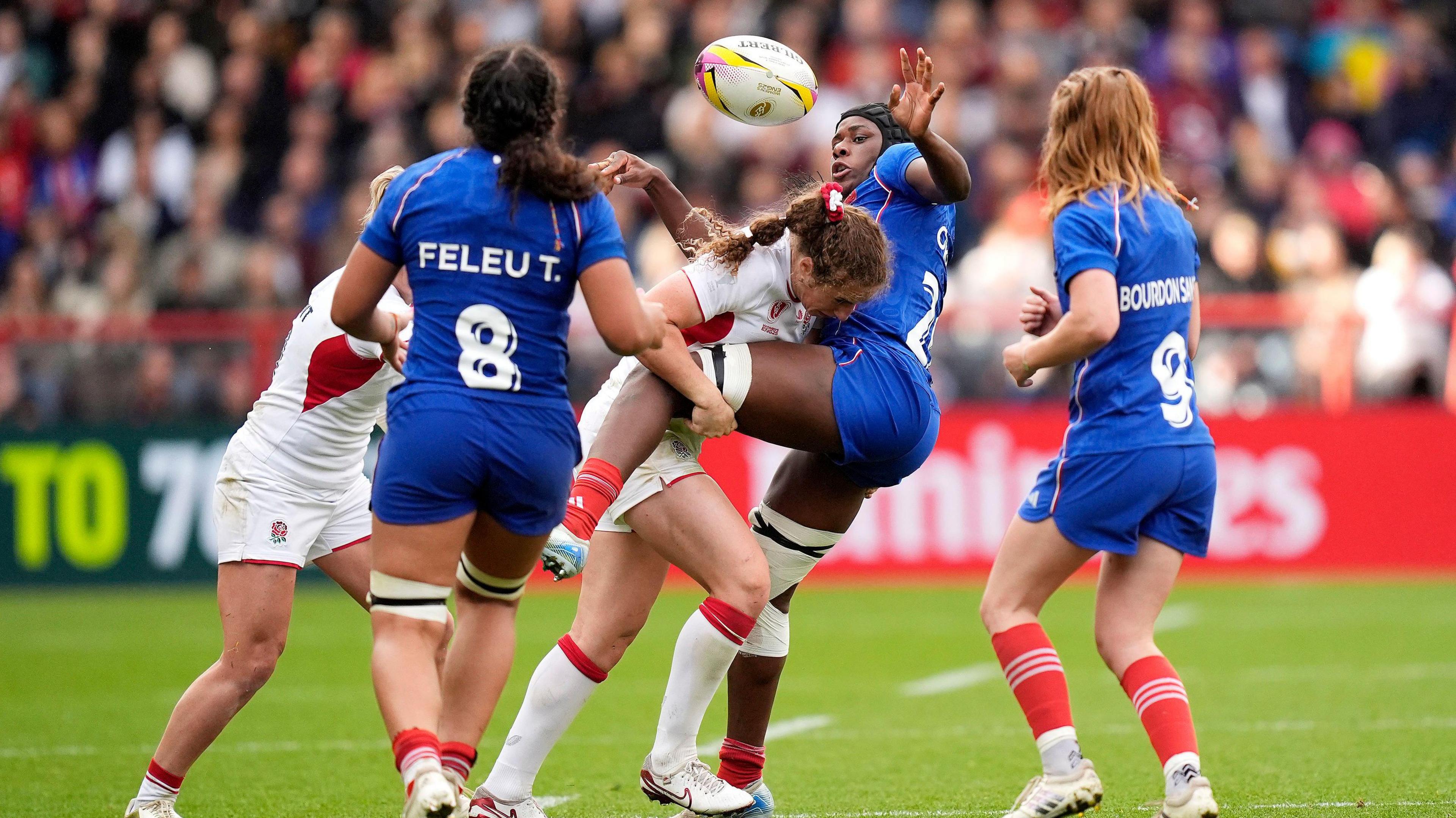 England making a tackle against the French women