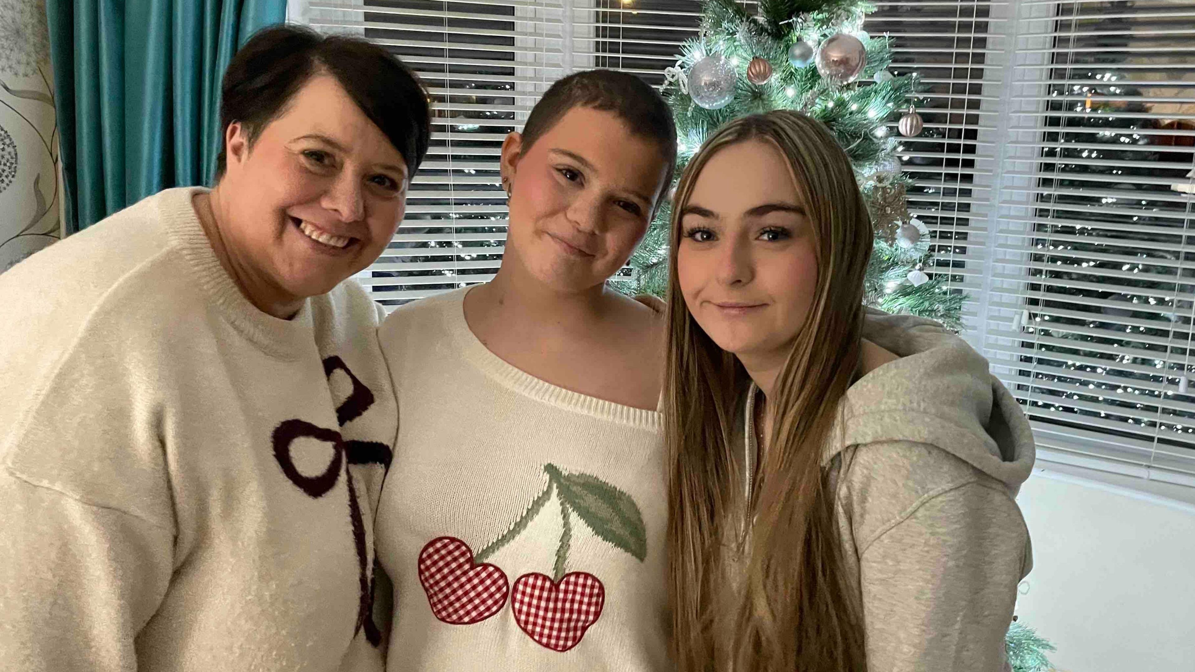 Izzy who is with her mum and friend Keely