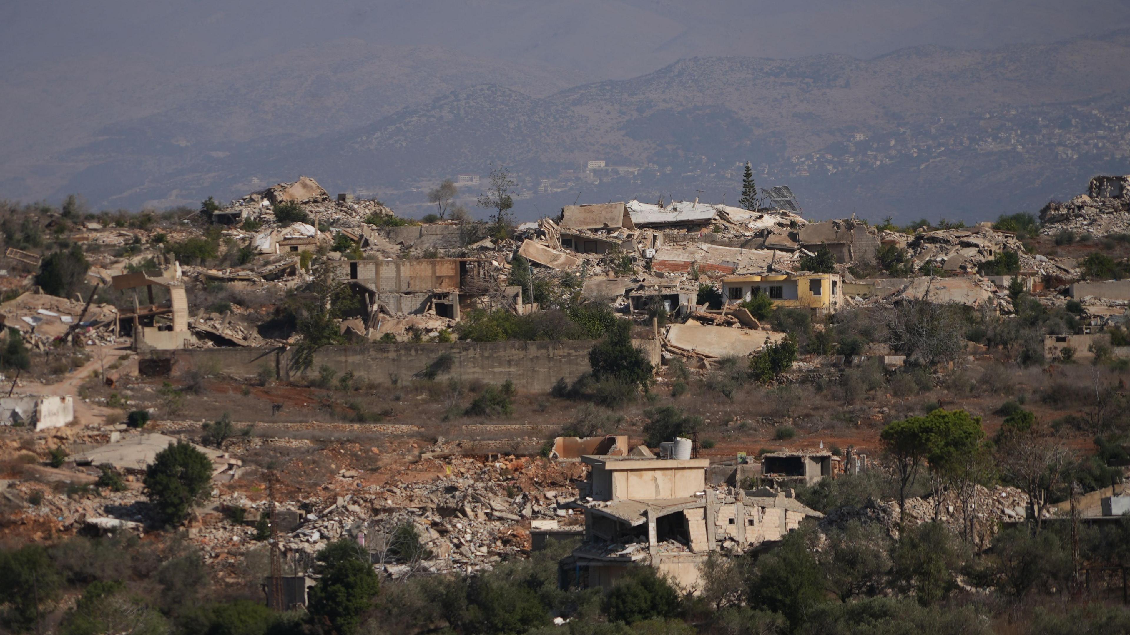 Destroyed buildings and piles of rubble are seen on a hillside in southern Lebanon.