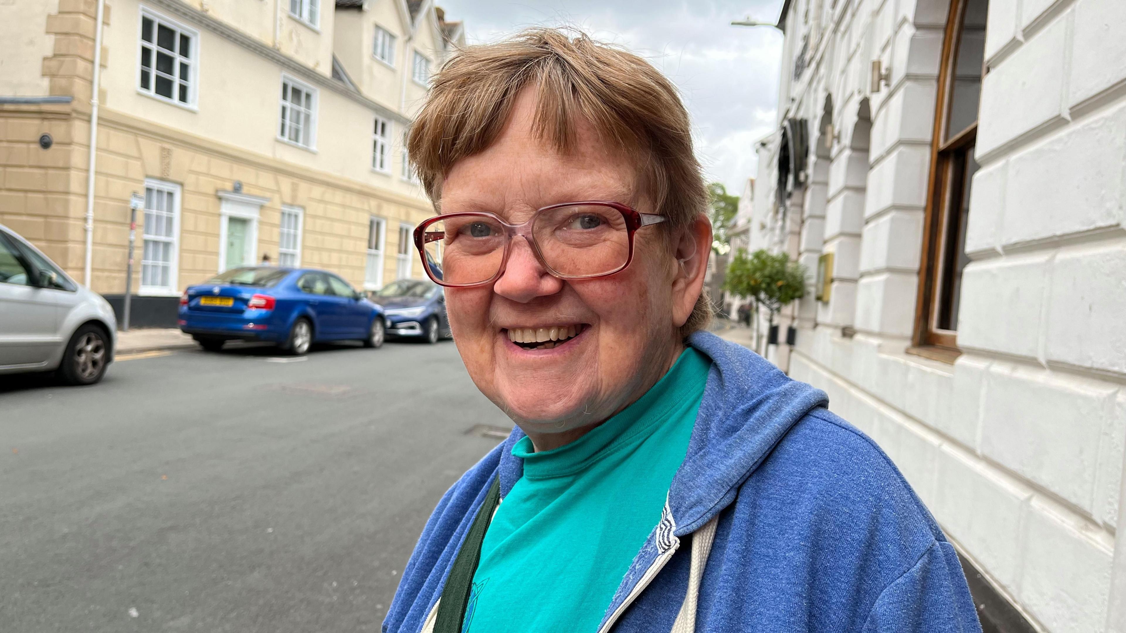 Cyclist Margaret Harris standing on the pavement in Colegate, Norwich