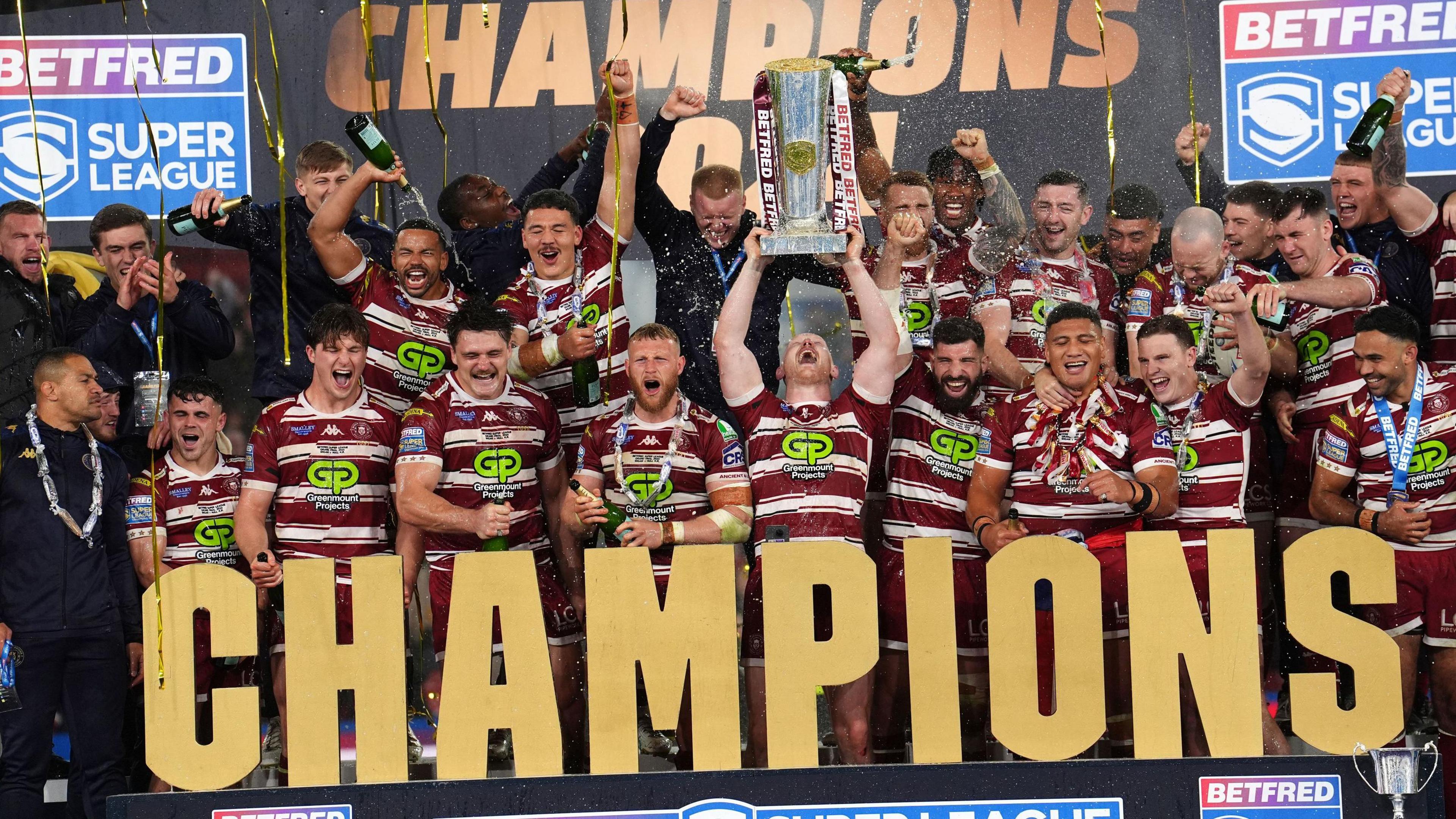 Wigan lift the Super League trophy after beating Hull KR in the Grand Final