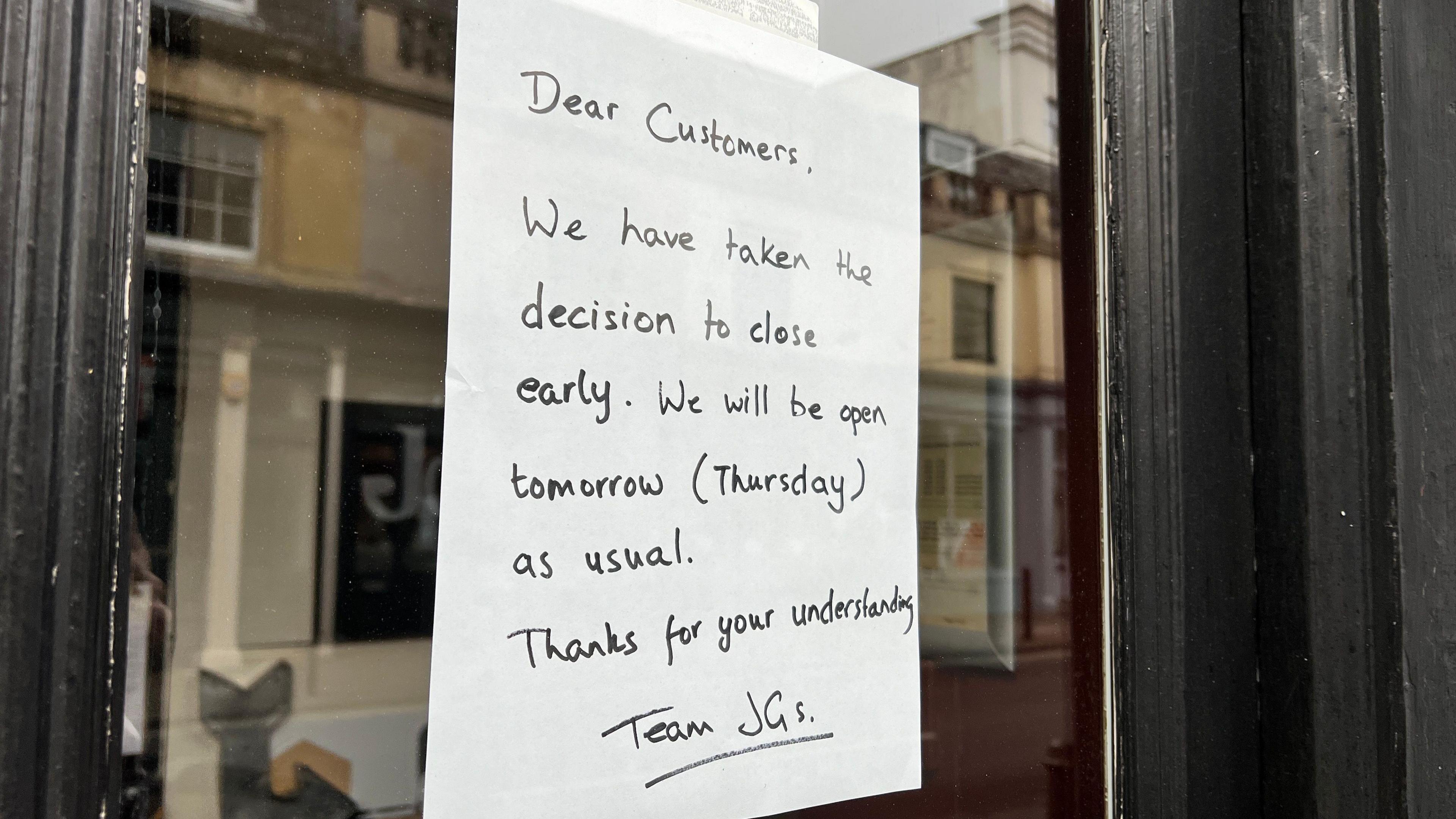 A sign with announced a bar's early closure