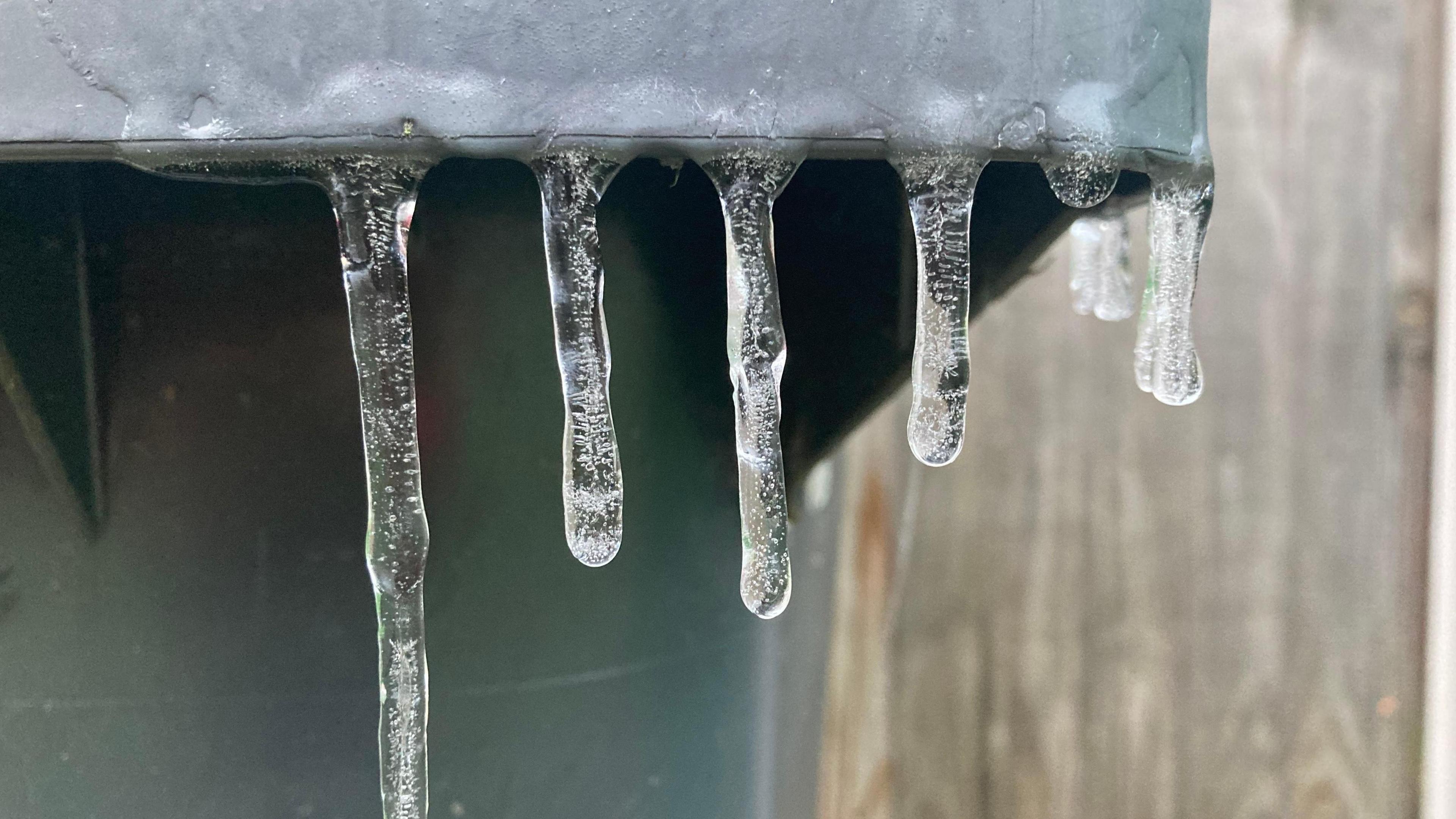 Ice stalagmites on a bin