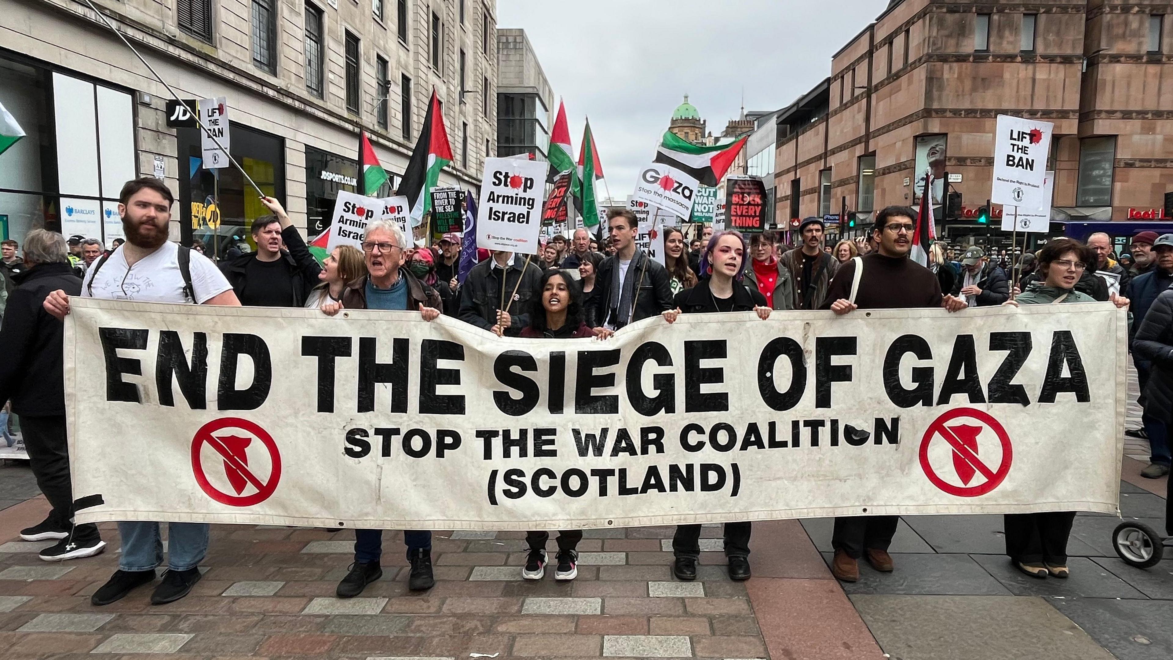 A group of pro-Palestine protesers marching through Glasgow City Centre on Saturday.