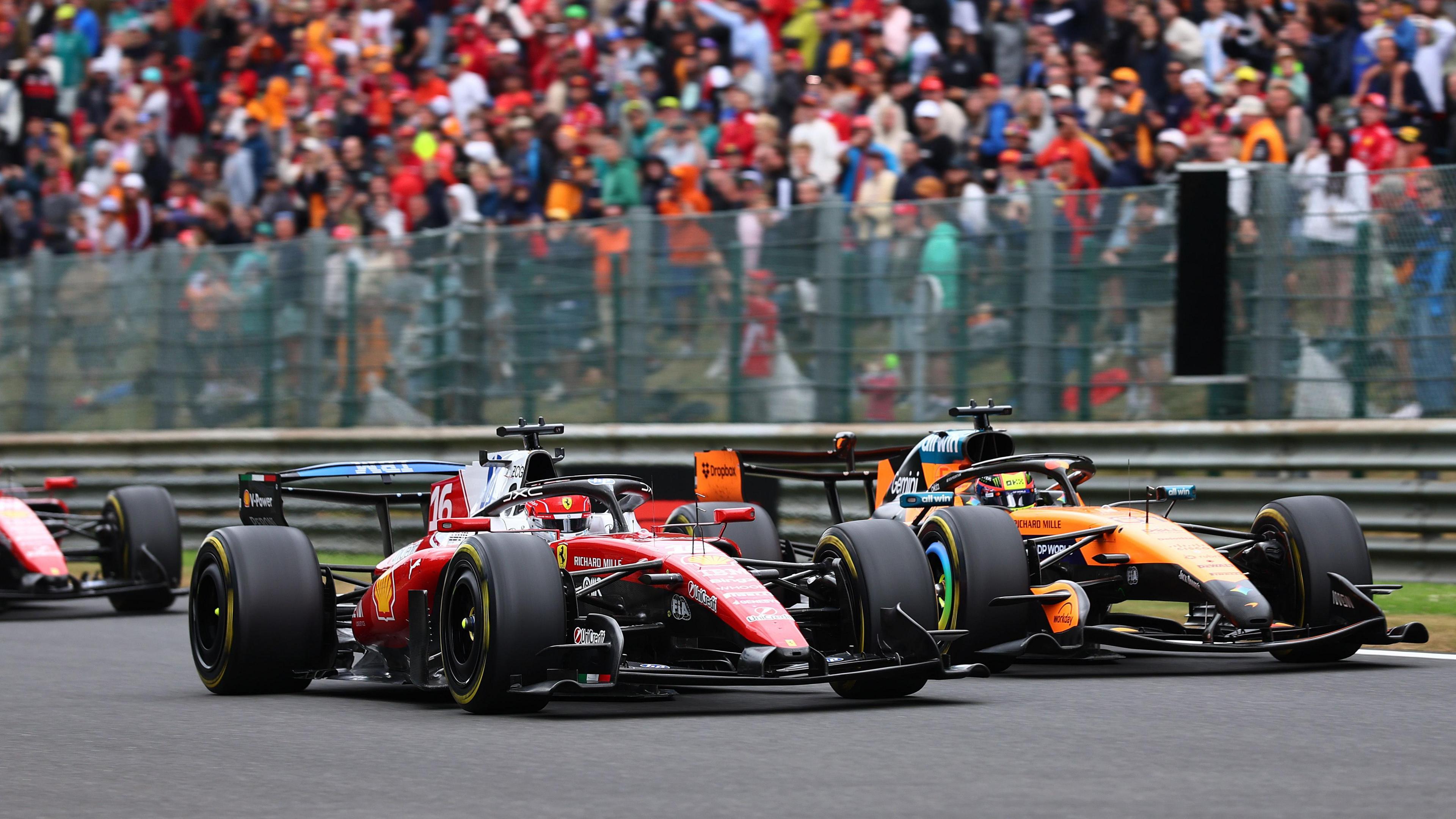 Ferrari's Charles Leclerc and McLaren's Oscar Piastri side by side during the Belgian Grand Prix