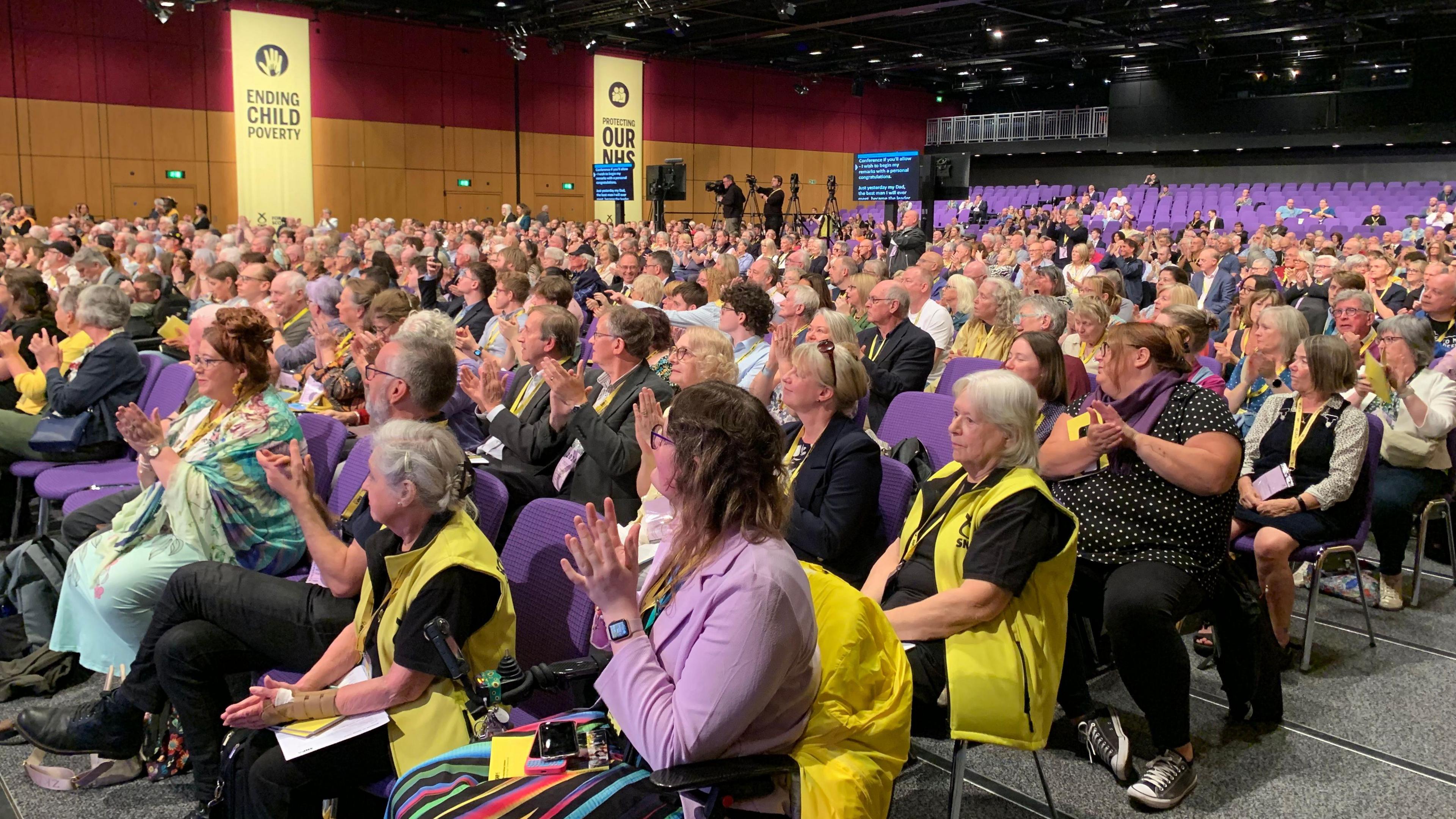 Crowd of people seated at SNP conference 