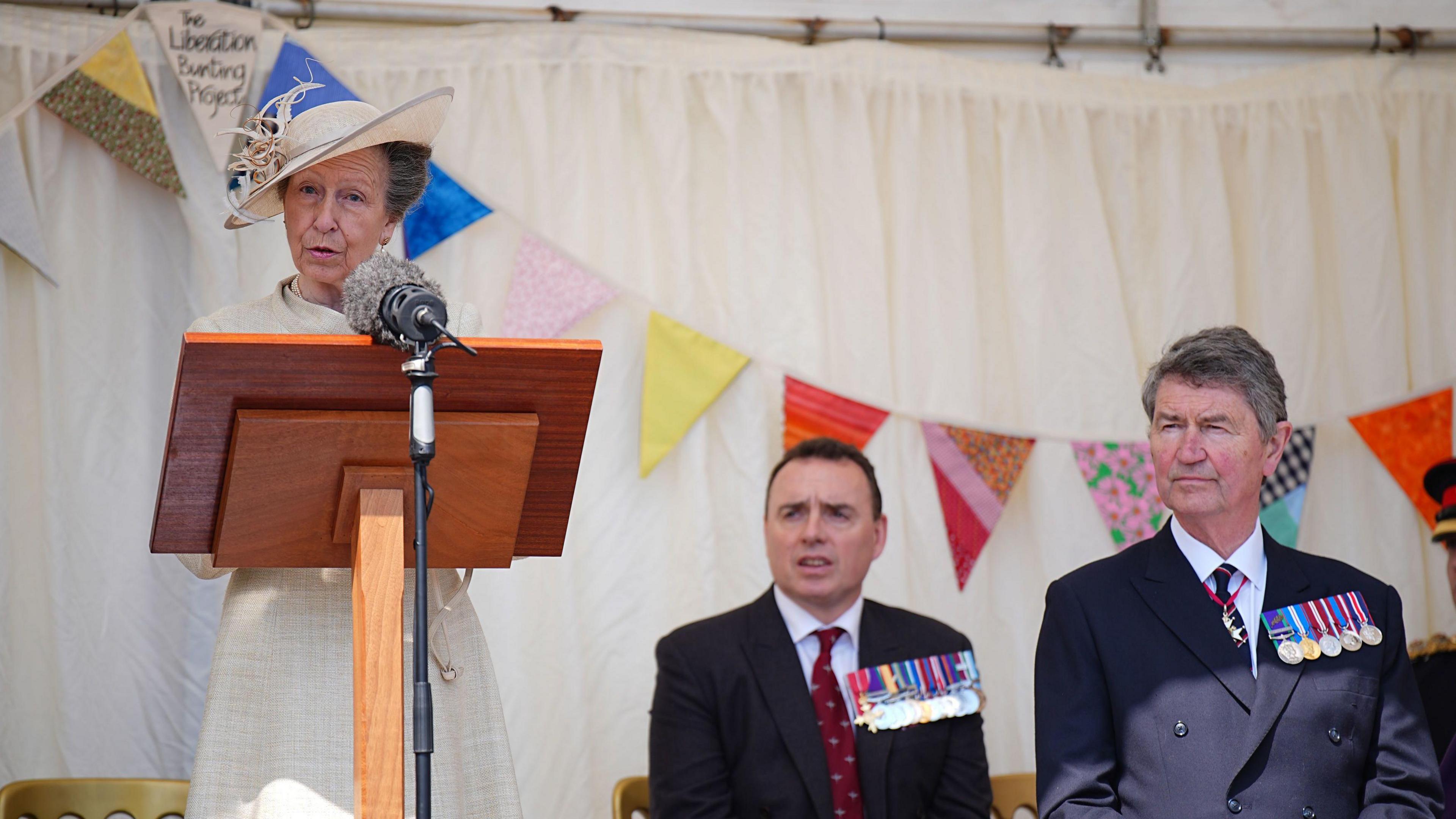 Vice Admiral Sir Tim Laurence (right) listens to The Princess Royal speaking during a visit to St Peter Port. 