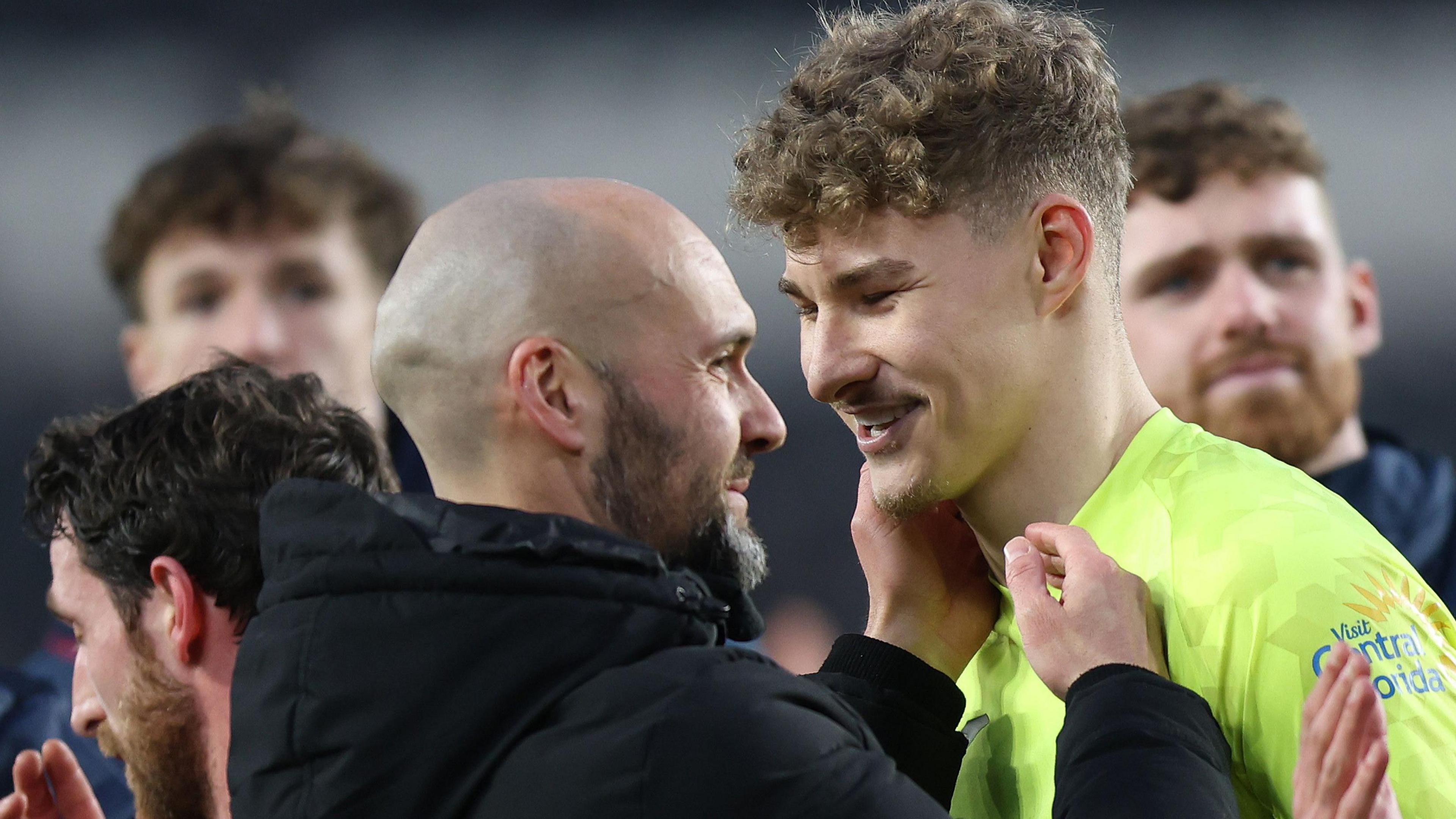 Head coach Luke Williams (L) and goalkeeper Carl Rushworth celebrate a Swansea victory last season 