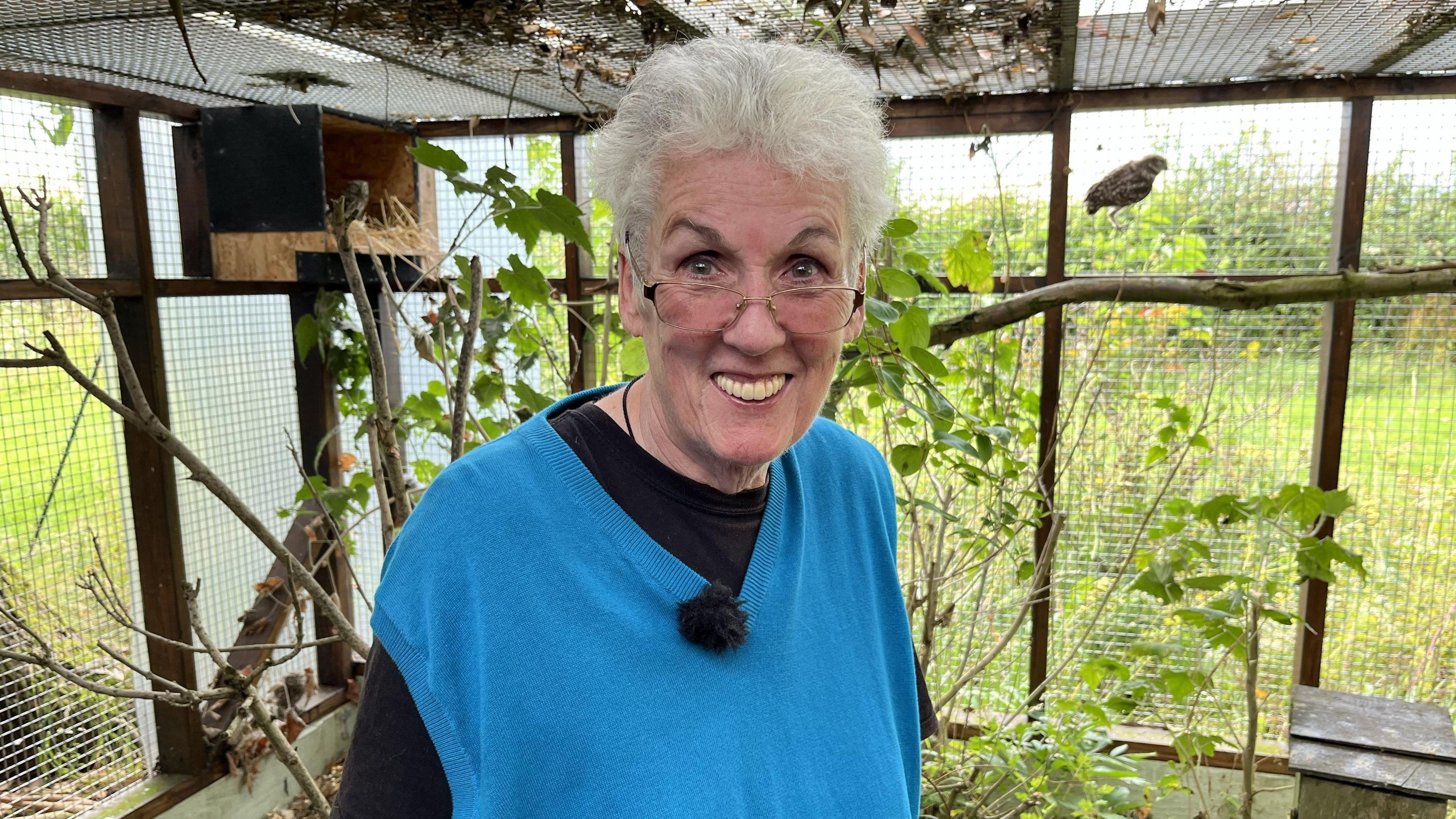 Stephanie Callister-Jarrold smiling and wearing a blue jumper