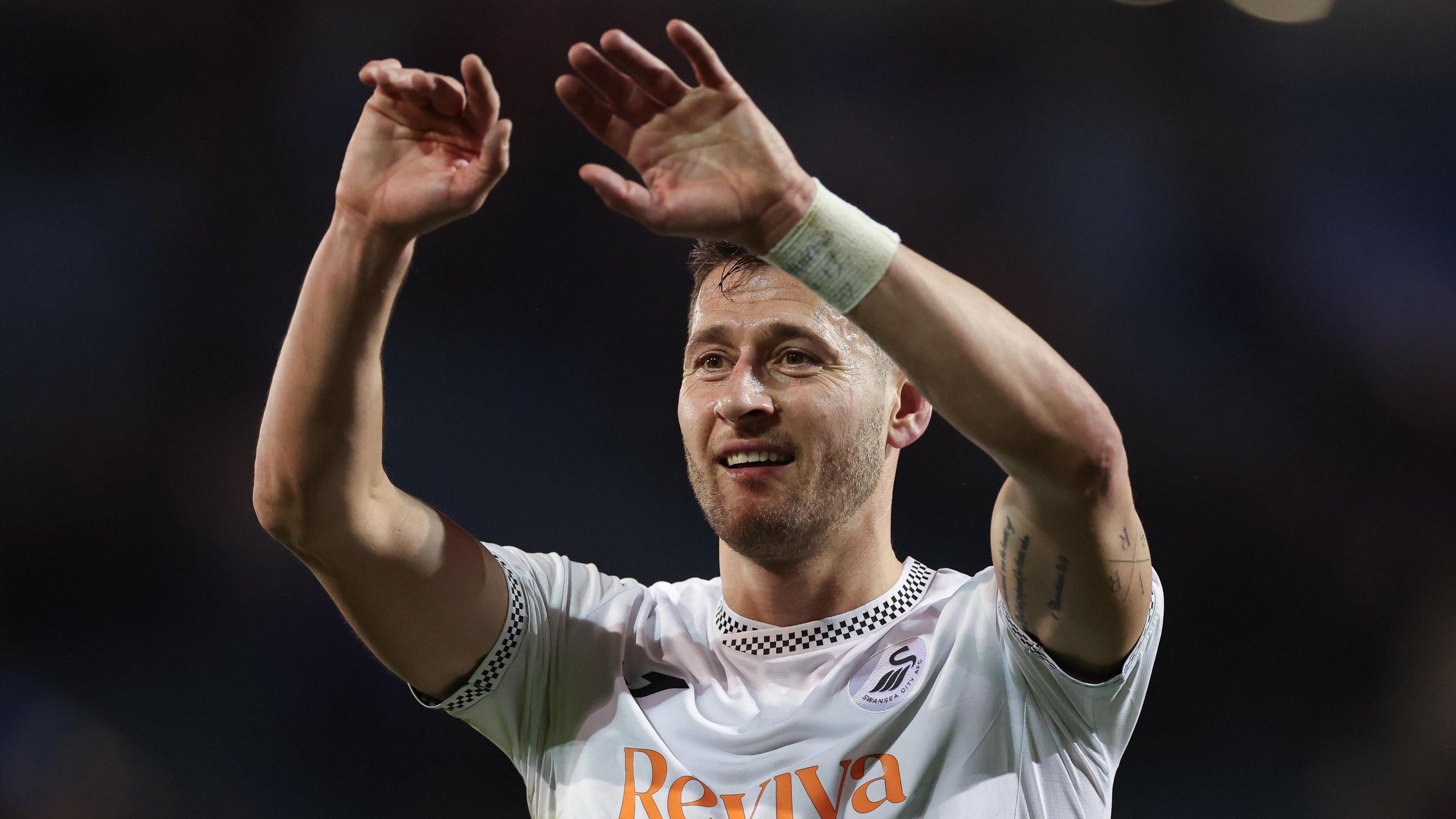 Joel Ward waves to the crowd after a Swansea game 