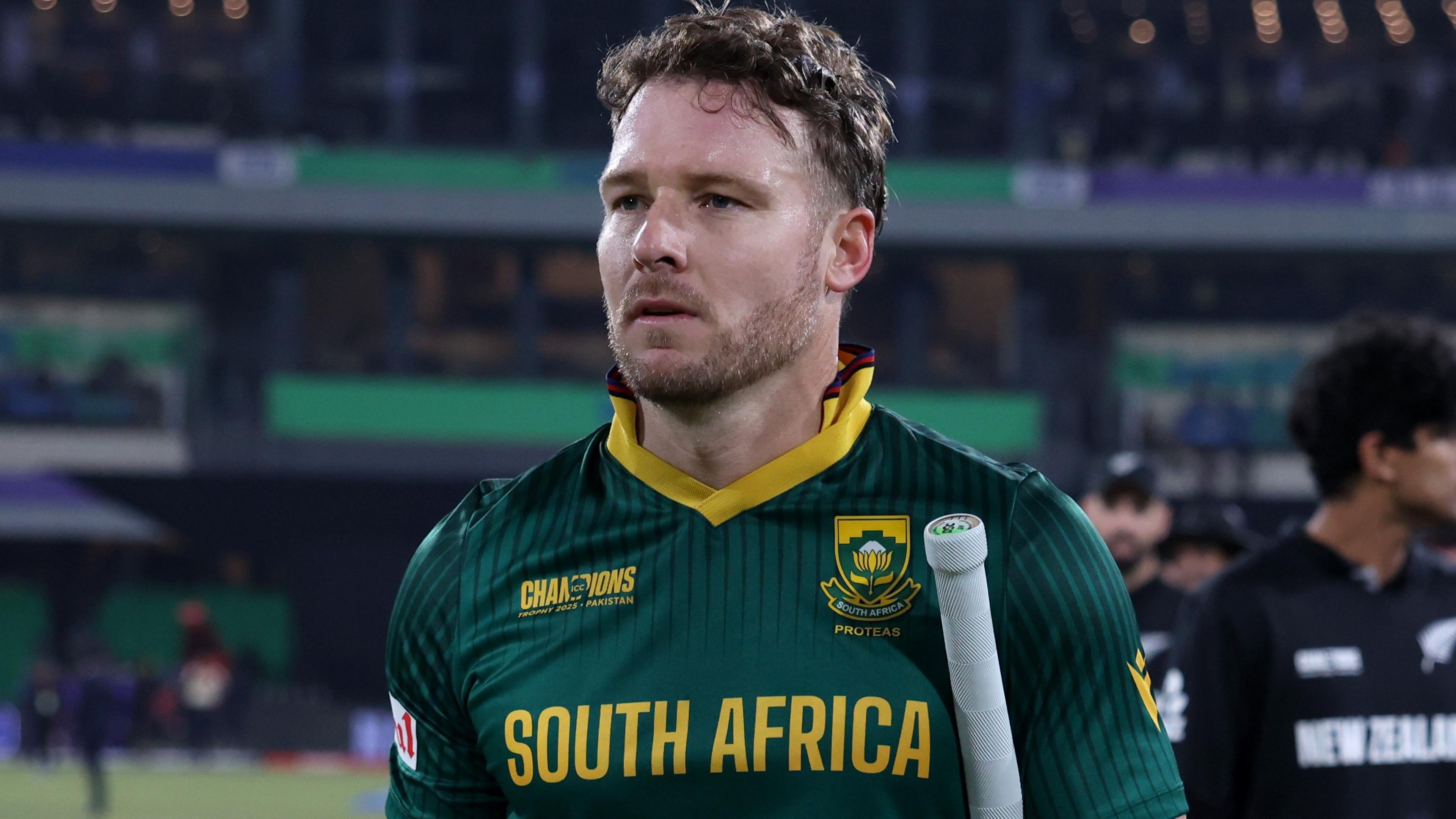 David Miller walks off with a bat under his arm