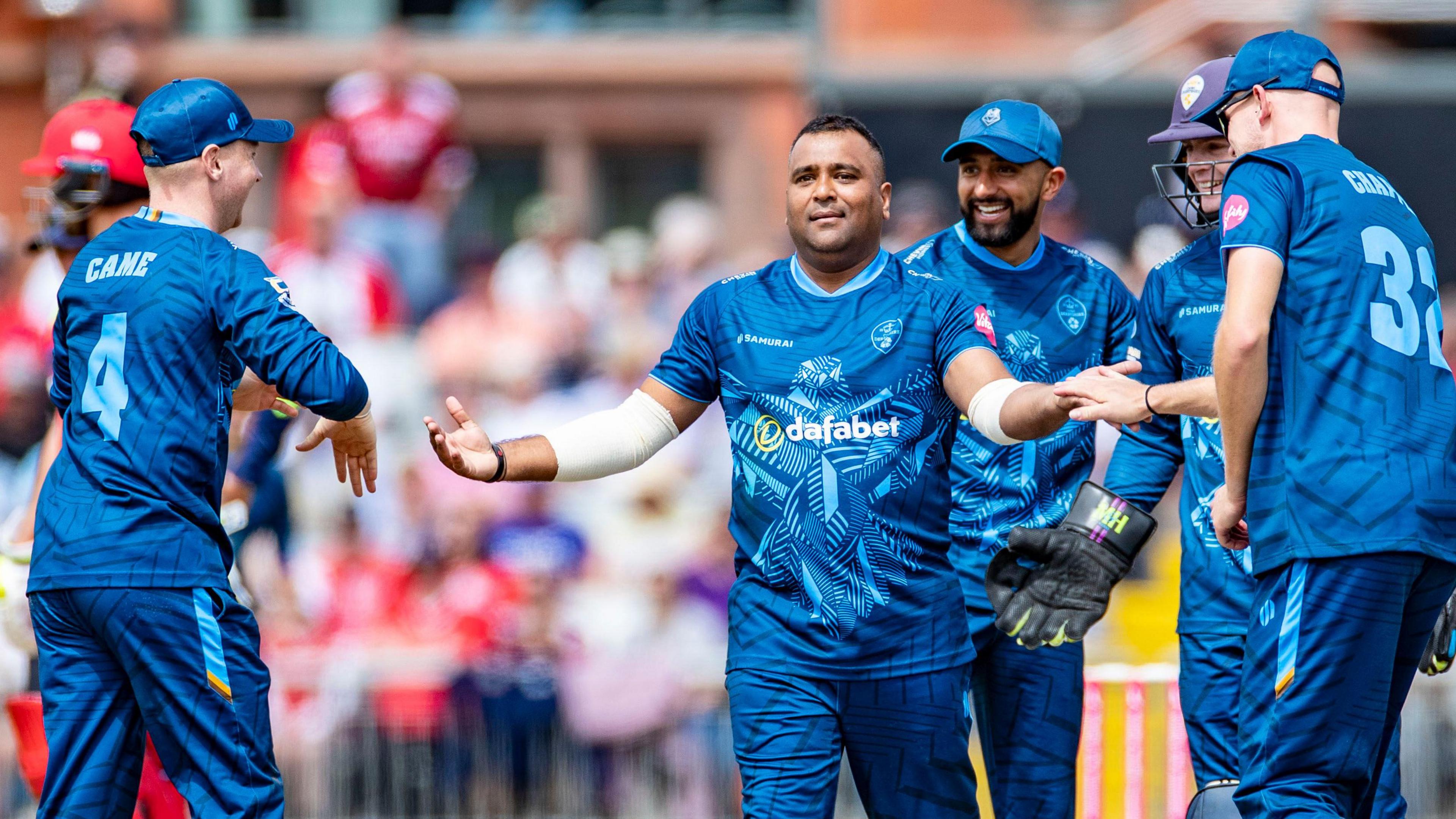 Samit Patel celebrates taking a wicket for Derbyshire