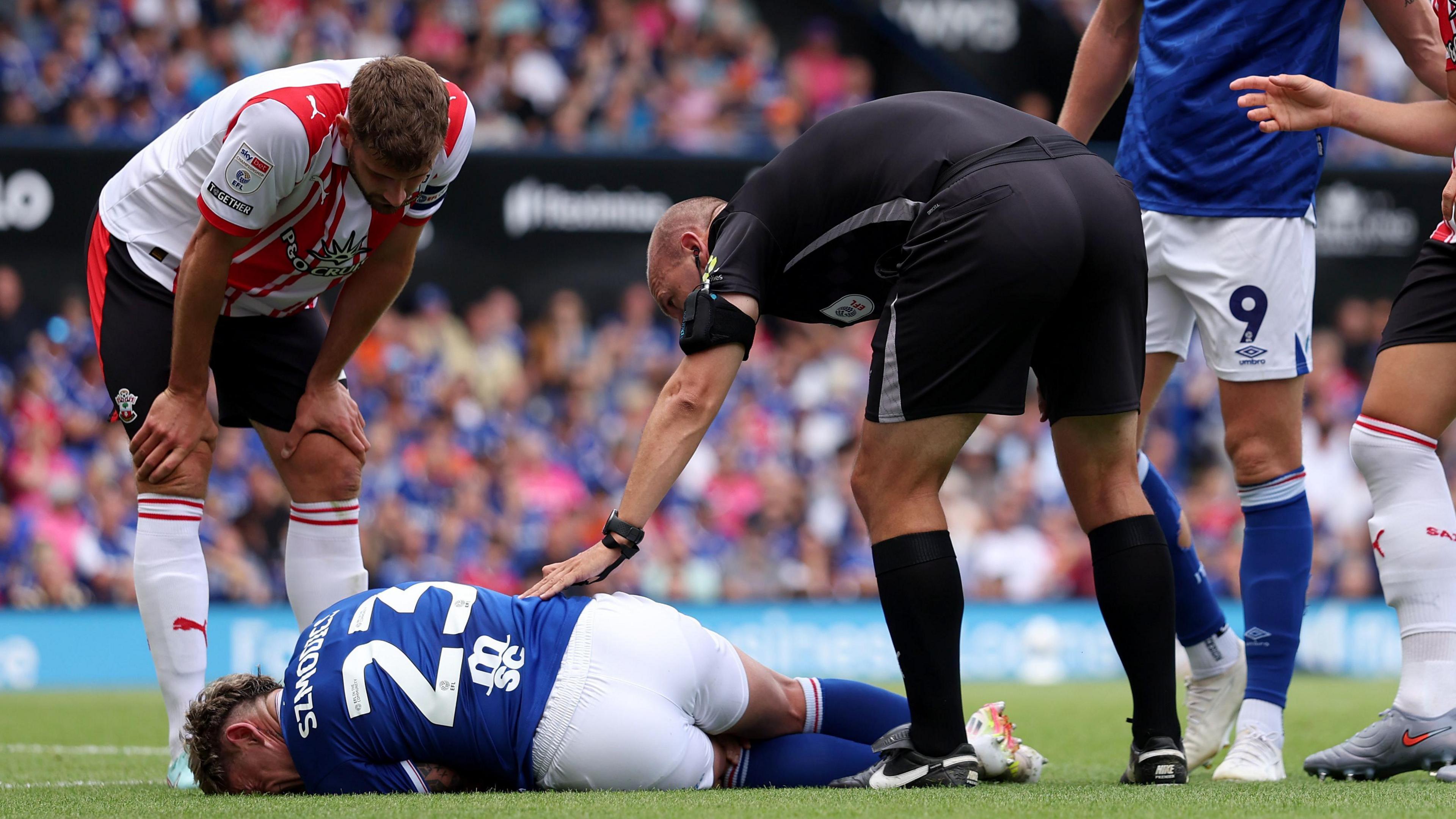 Sammie Szmodics lying on the ground during Ipswich's game against Southampton