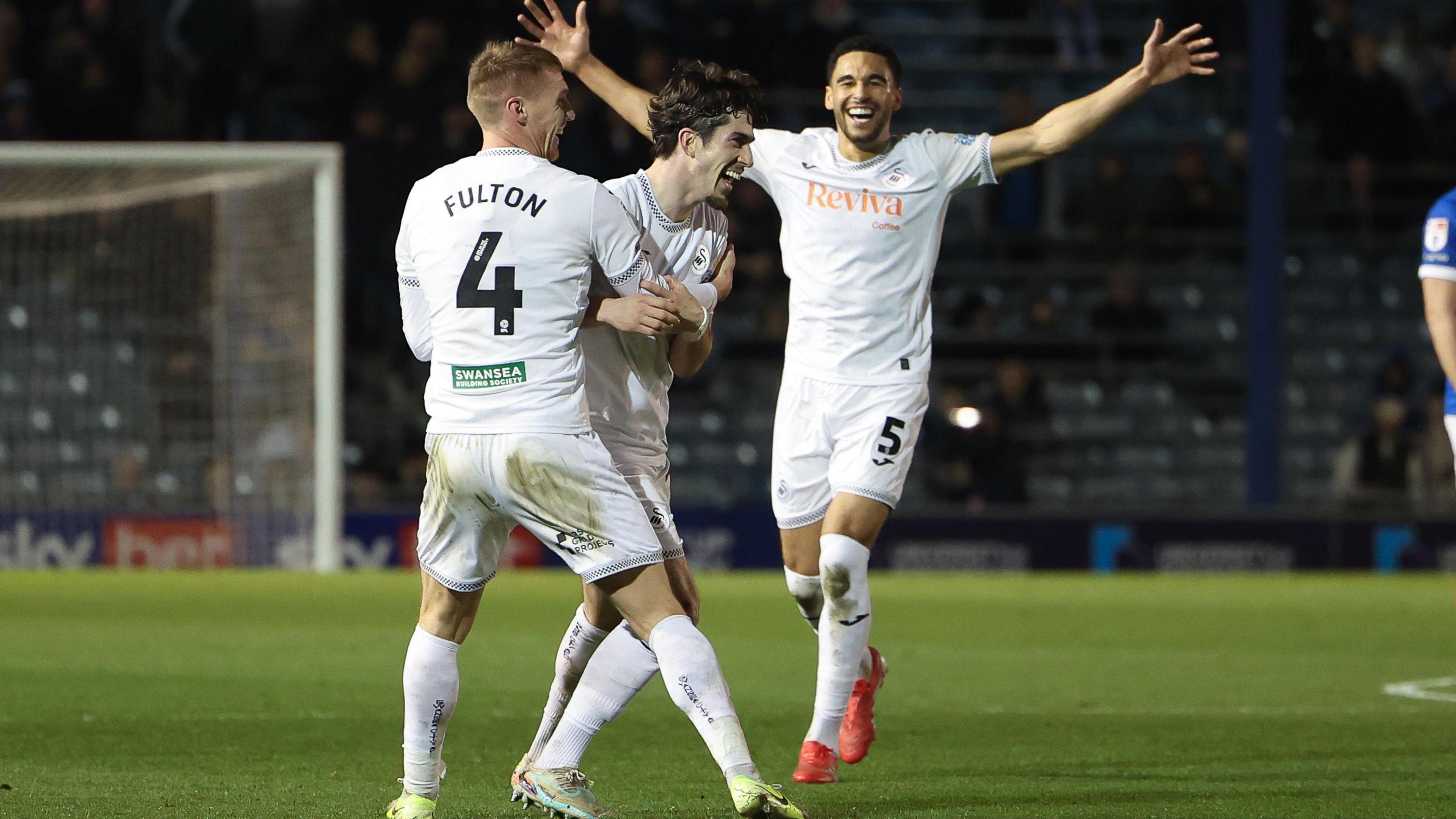 Josh Key celebrates with Jay Fulton and Ben Cabango
