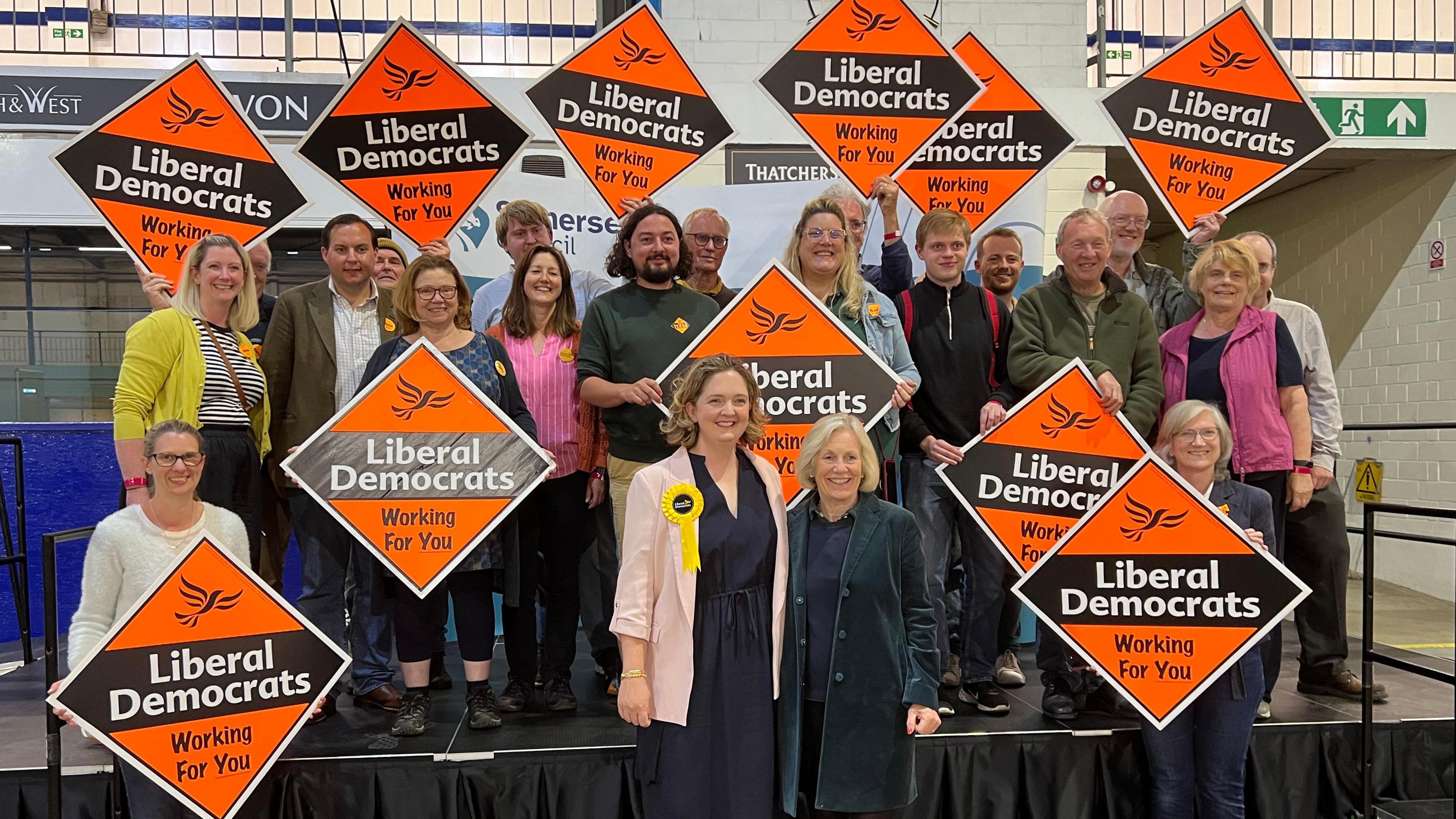 Anna Sabine and her campaign group all holding up signs