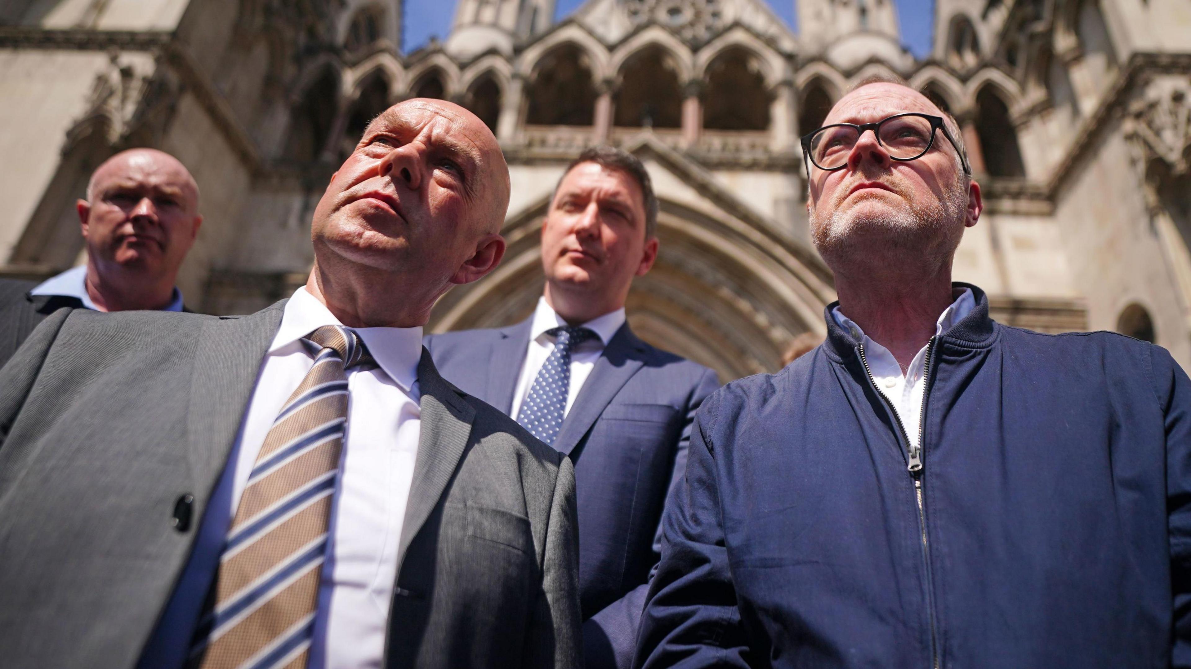 Journalists Barry McCaffrey (left) and Trevor Birney (right) speaking to media after leaving the Royal Courts of Justice, in London