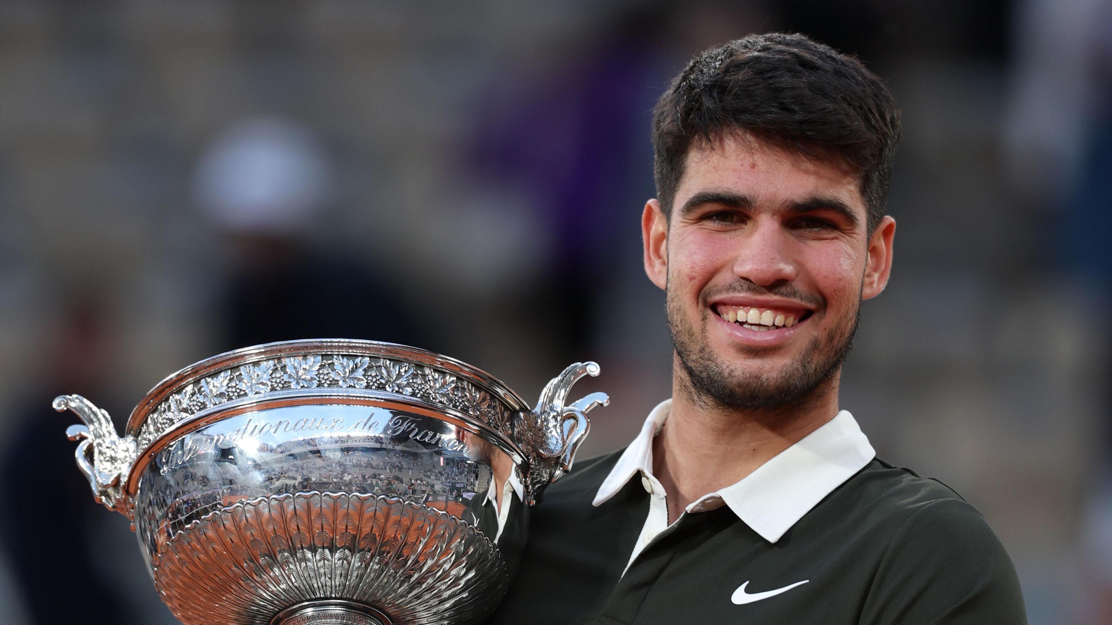 Carlos Alcaraz lifts the French Open trophy
